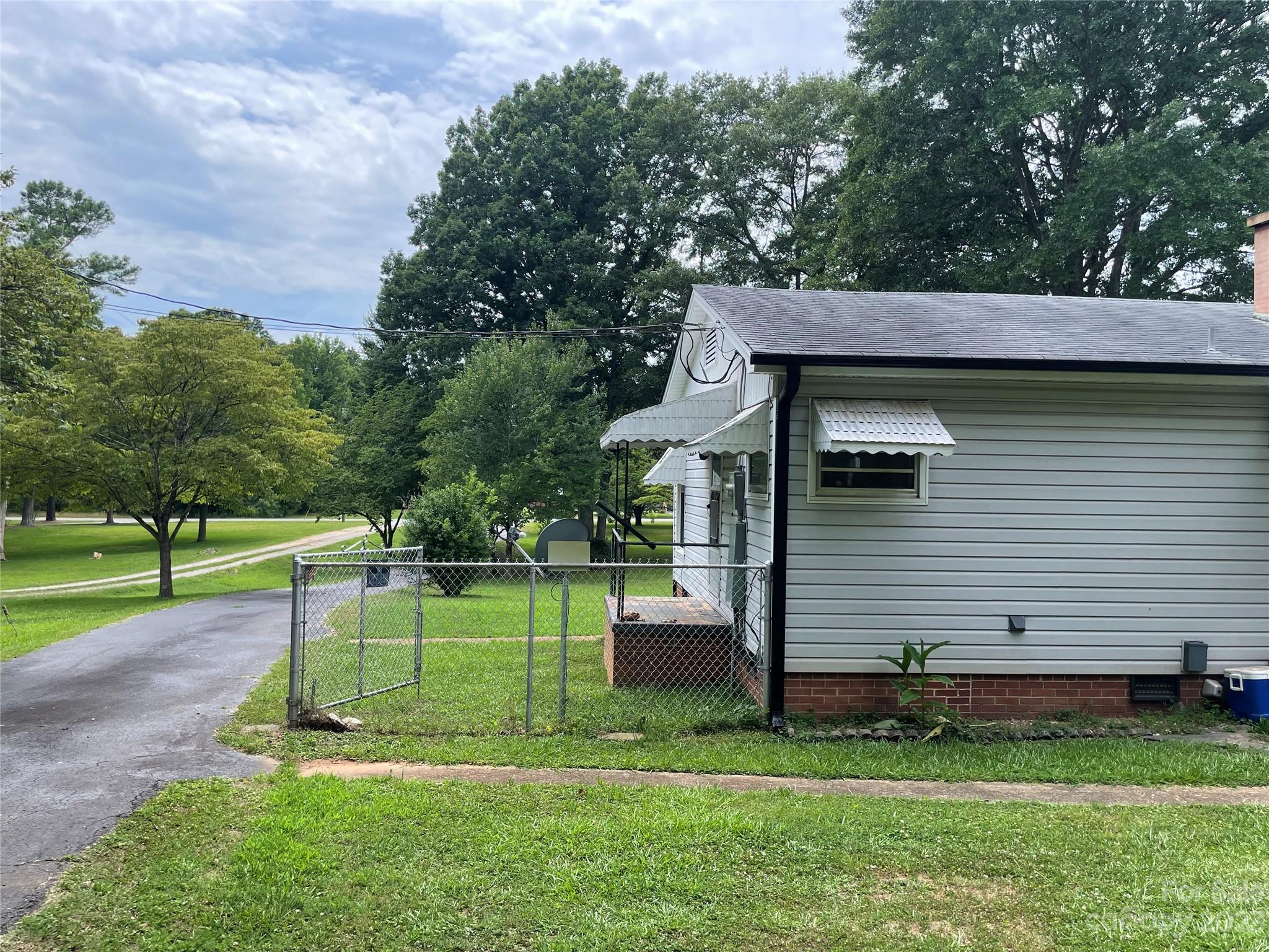 1125 Dunlap Roddey Road Rock Hill, SC 29730 - Photo 22 of 28 a view of a backyard with a slide