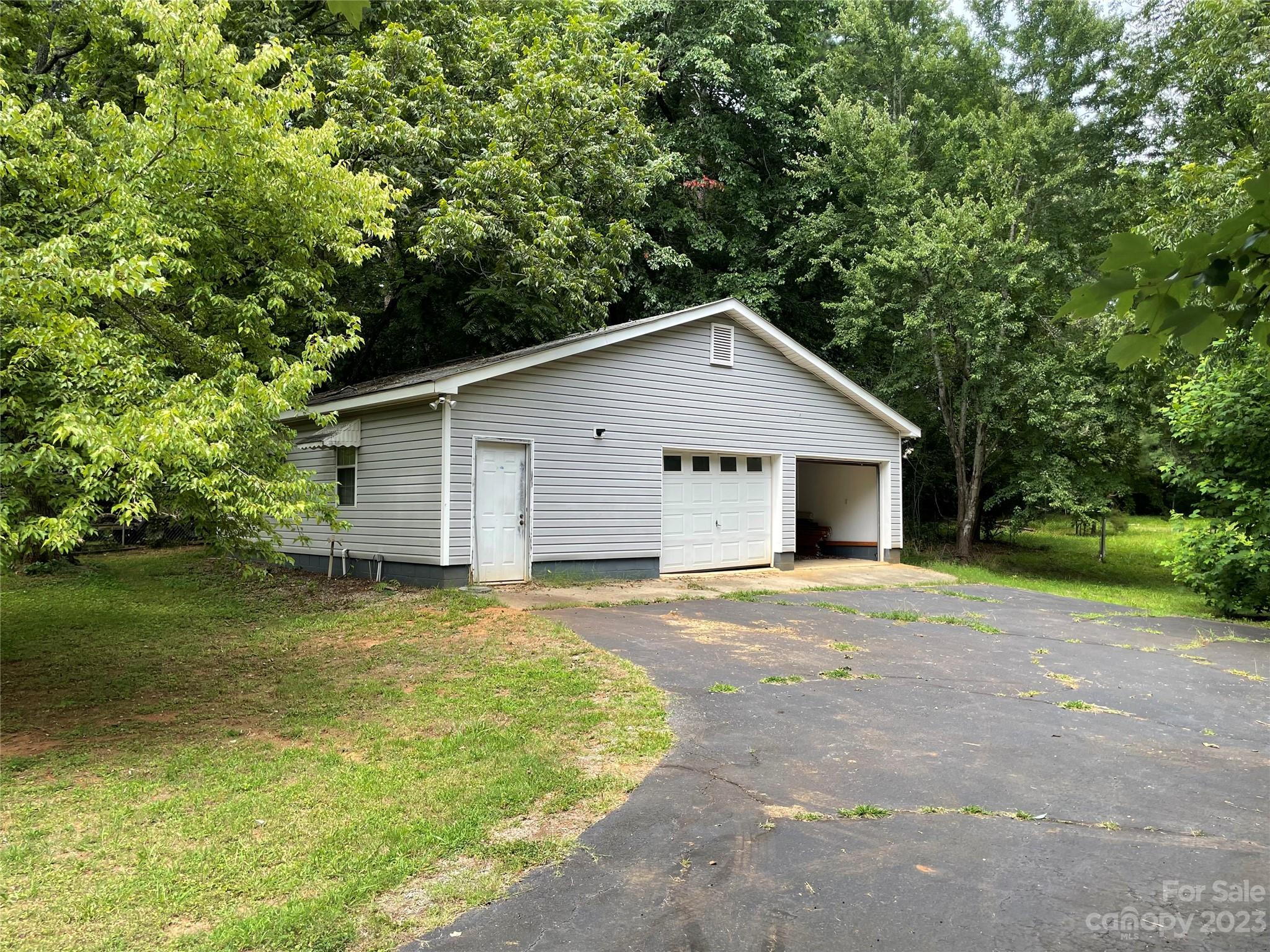 1125 Dunlap Roddey Road Rock Hill, SC 29730 - Photo 24 of 28 a view of a house with a yard and garage