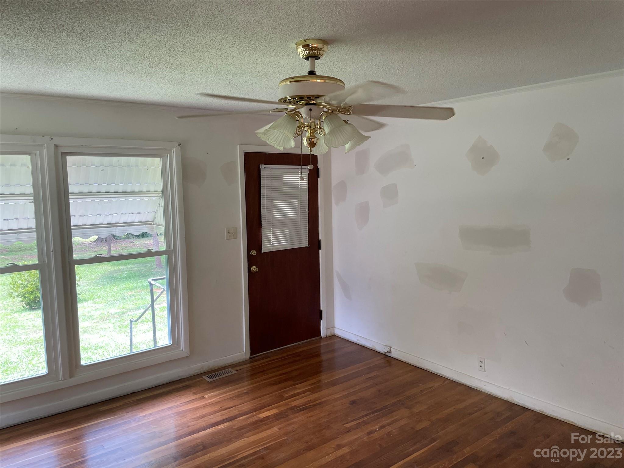 1125 Dunlap Roddey Road Rock Hill, SC 29730 - Photo 3 of 28 wooden floor in an empty room with a window