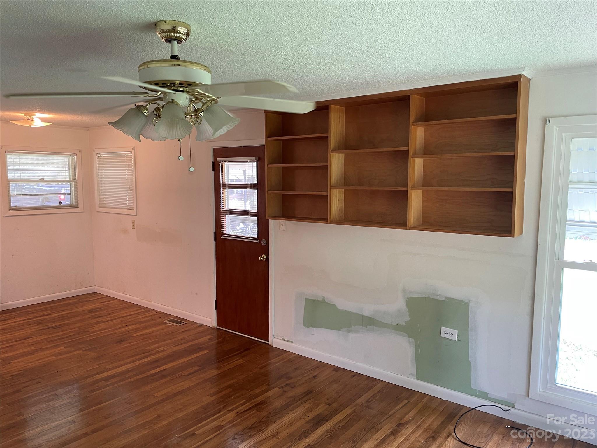 1125 Dunlap Roddey Road Rock Hill, SC 29730 - Photo 4 of 28 a view of a living room with a chandelier fan and wooden floor