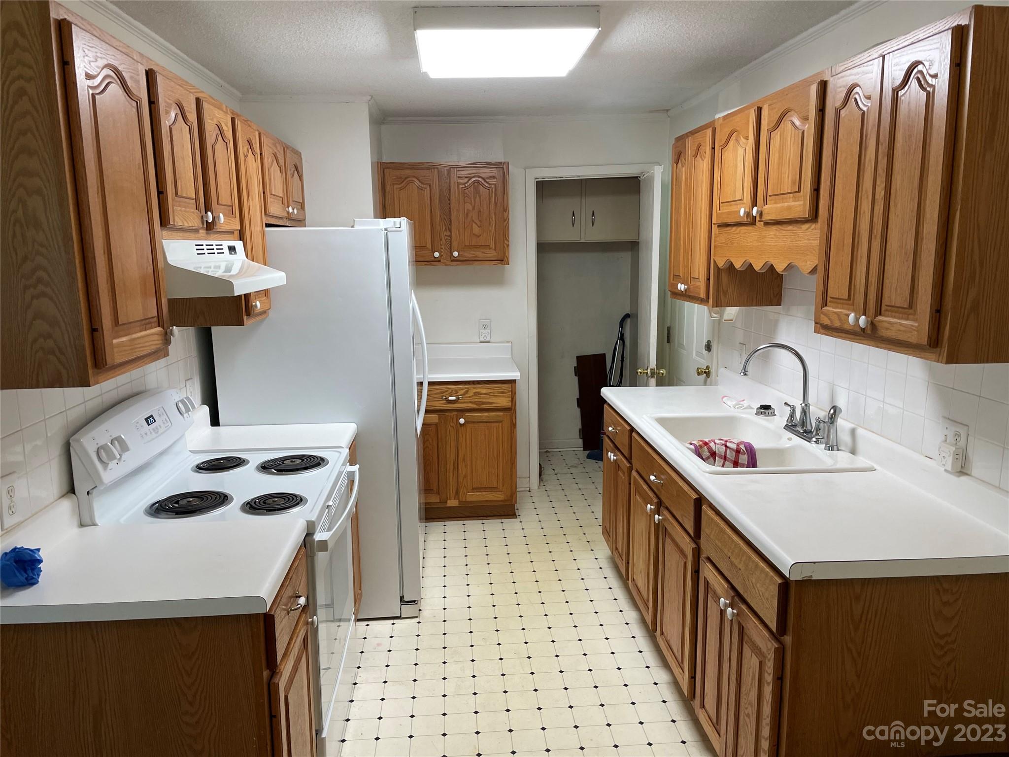 1125 Dunlap Roddey Road Rock Hill, SC 29730 - Photo 6 of 28 a kitchen with a sink a stove and a refrigerator
