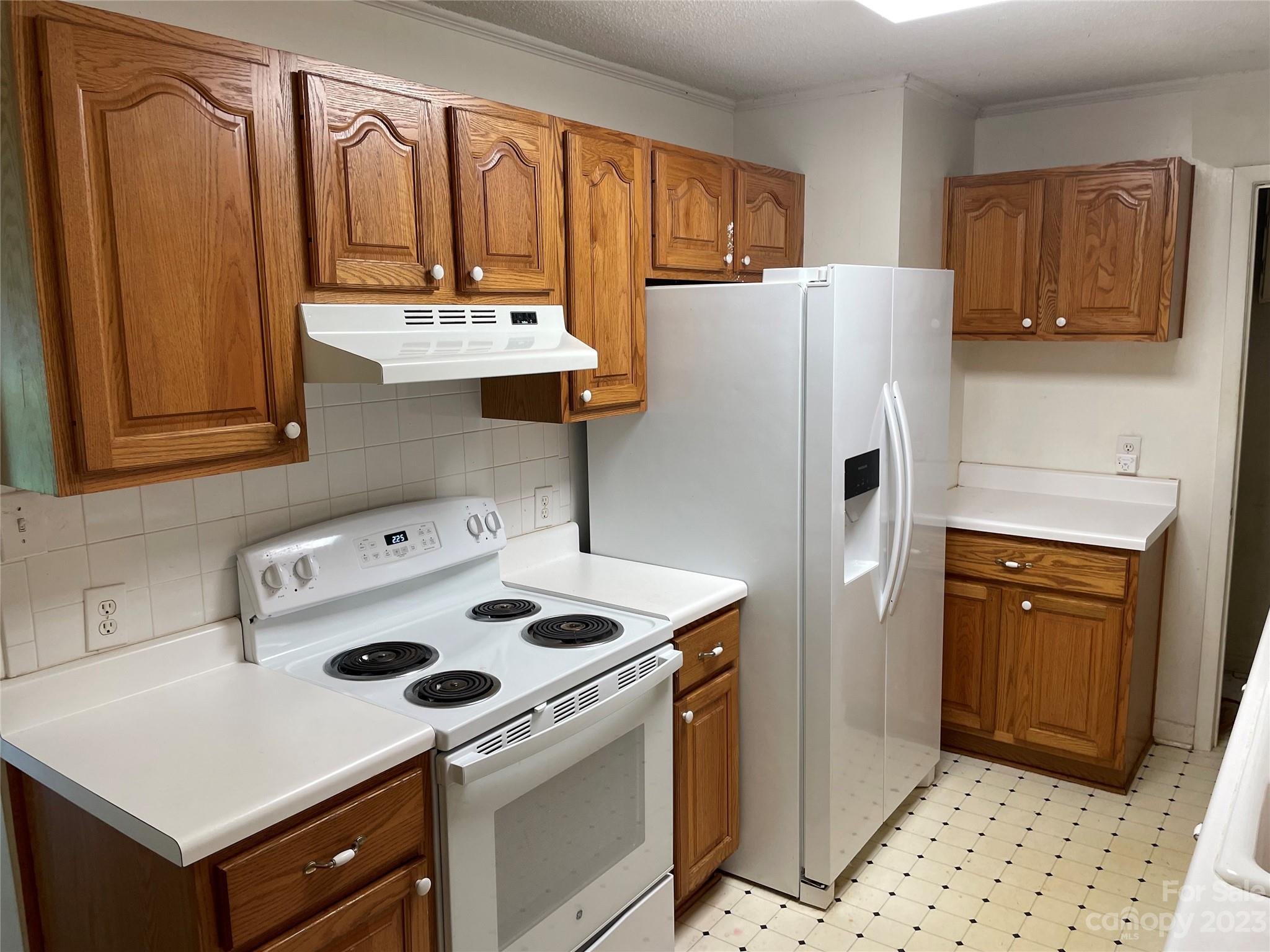 1125 Dunlap Roddey Road Rock Hill, SC 29730 - Photo 7 of 28 a kitchen with refrigerator and stove