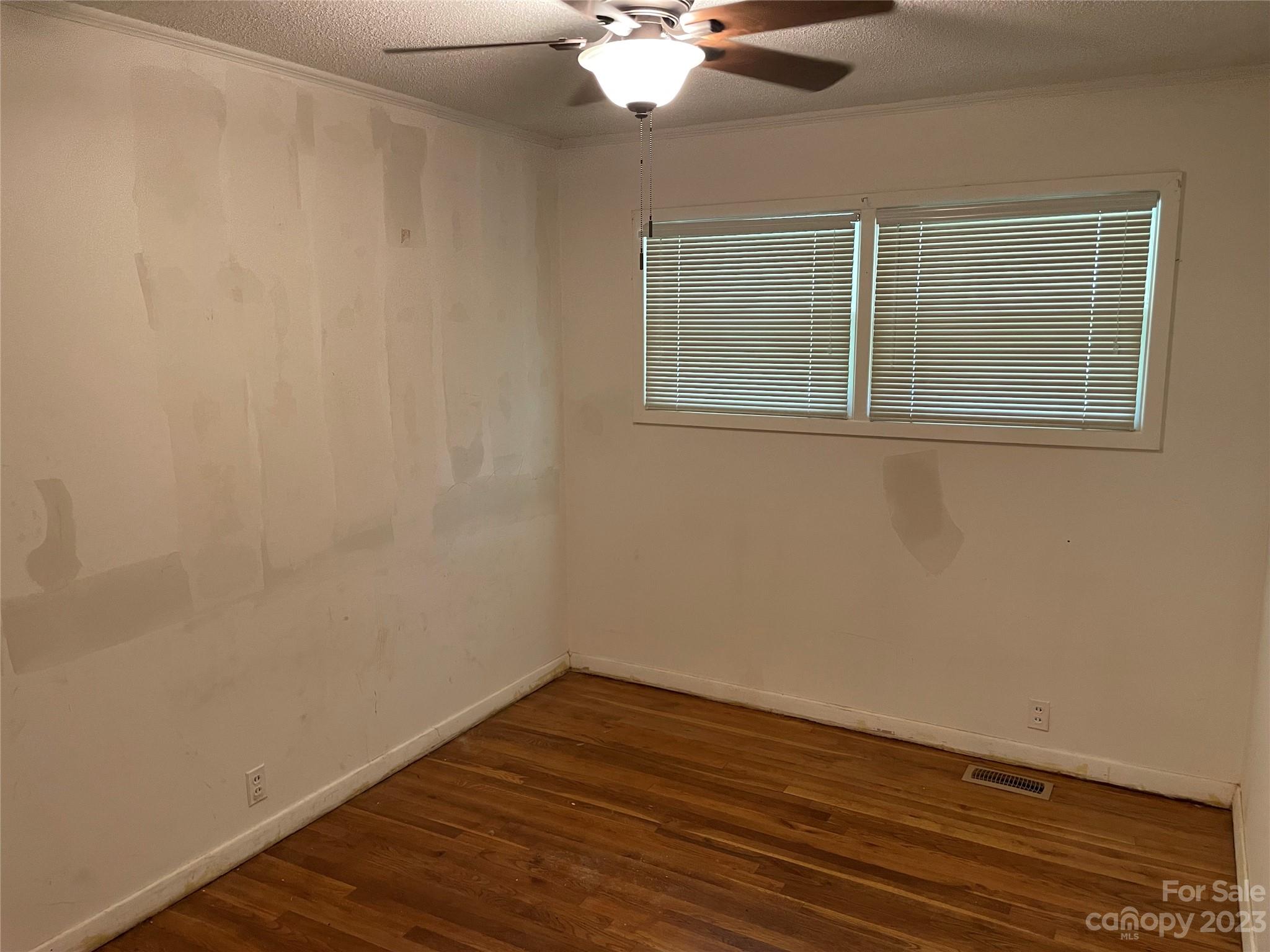 1125 Dunlap Roddey Road Rock Hill, SC 29730 - Photo 10 of 28 a view of an empty room with wooden floor and a window