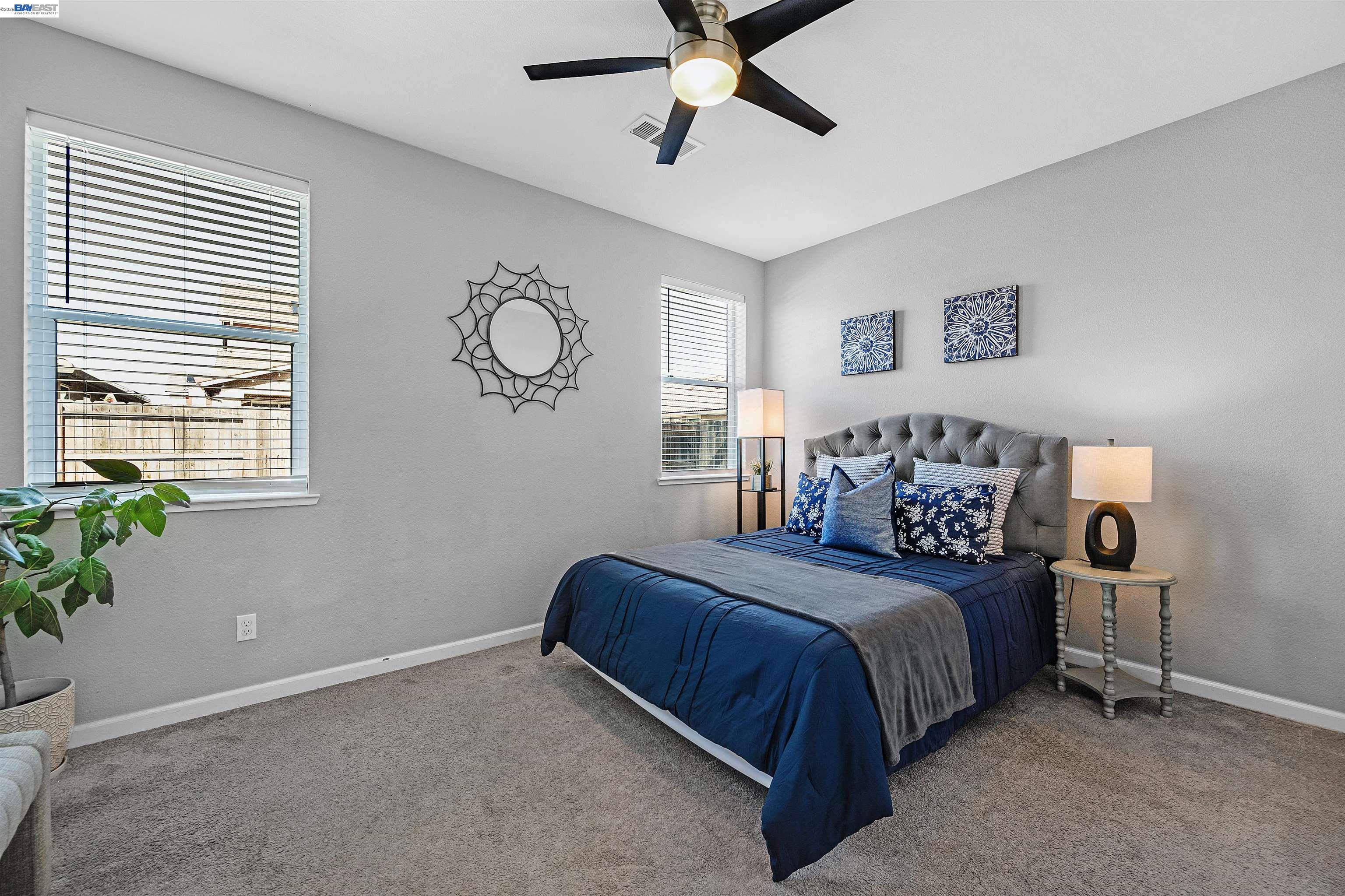1589 Friendly Street Manteca, CA 95337 - Photo 18 of 50 a bedroom with a bed and window