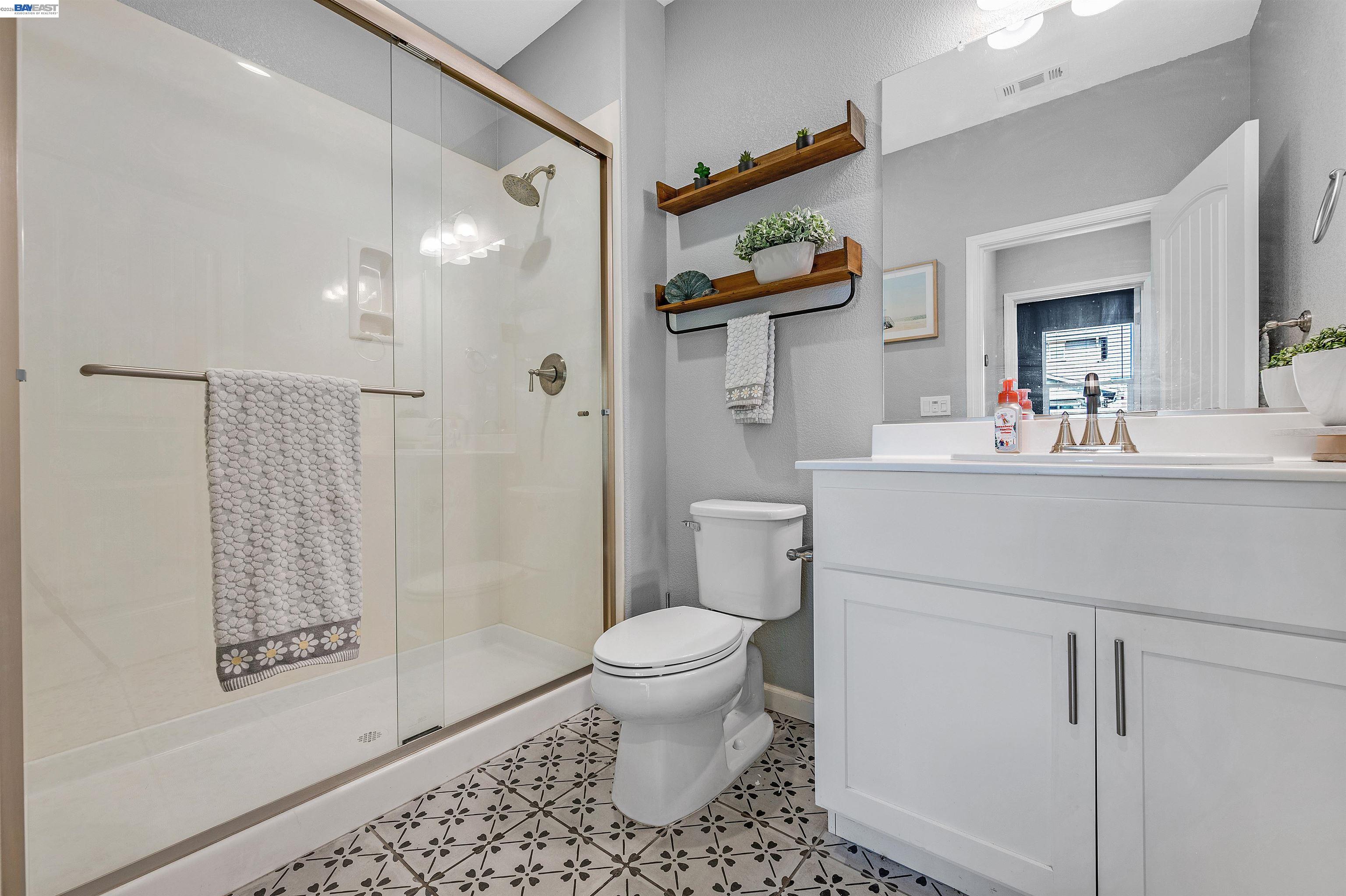 1589 Friendly Street Manteca, CA 95337 - Photo 24 of 50 a bathroom with a sink toilet and shower