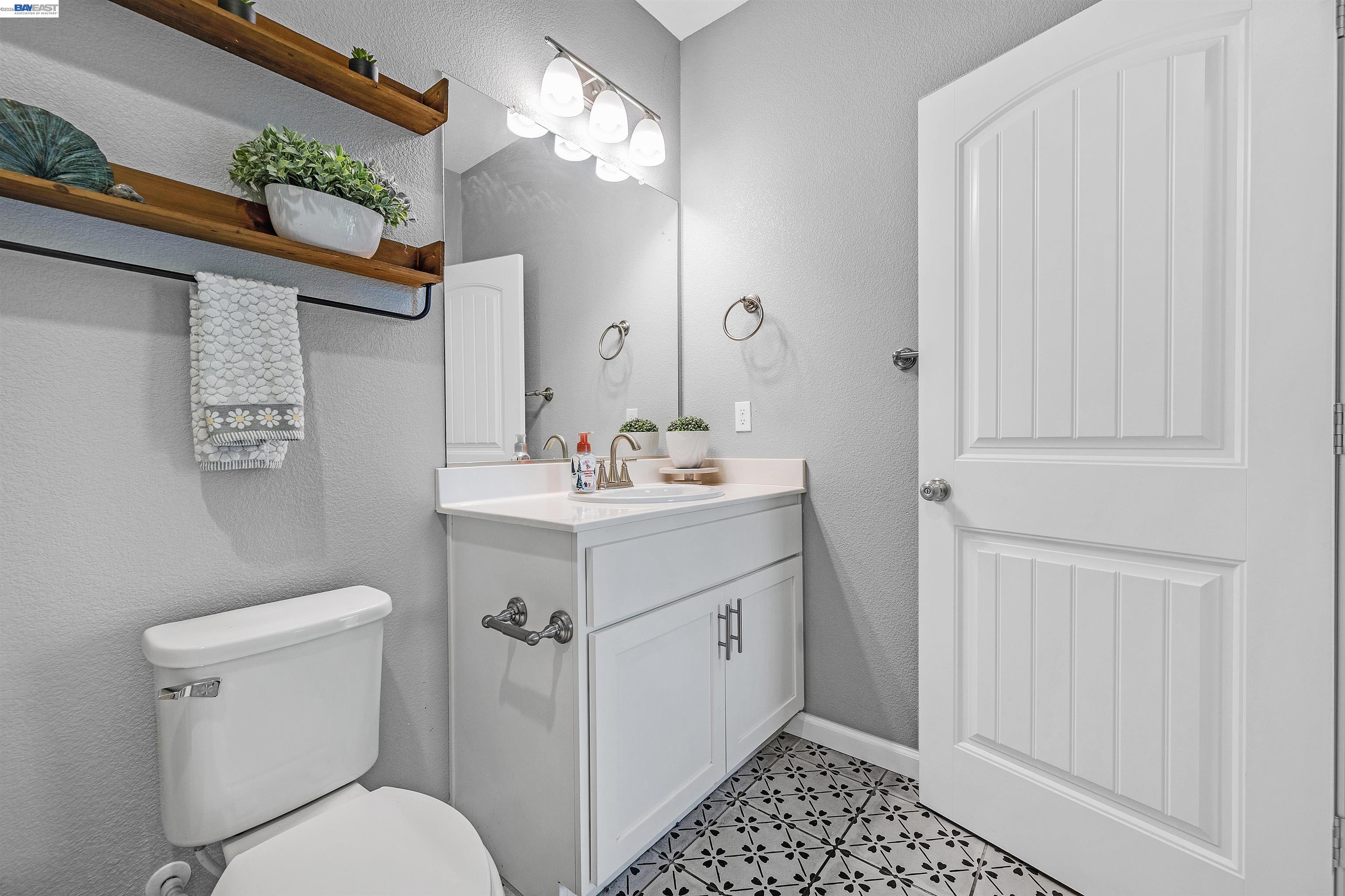 1589 Friendly Street Manteca, CA 95337 - Photo 25 of 50 a bathroom with a sink a toilet and shower