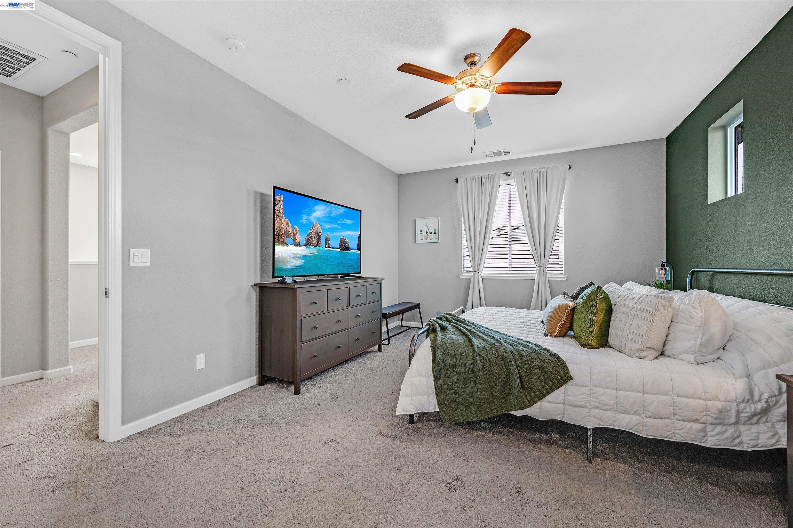 1589 Friendly Street Manteca, CA 95337 - Photo 29 of 50 a living room with furniture and a flat screen tv
