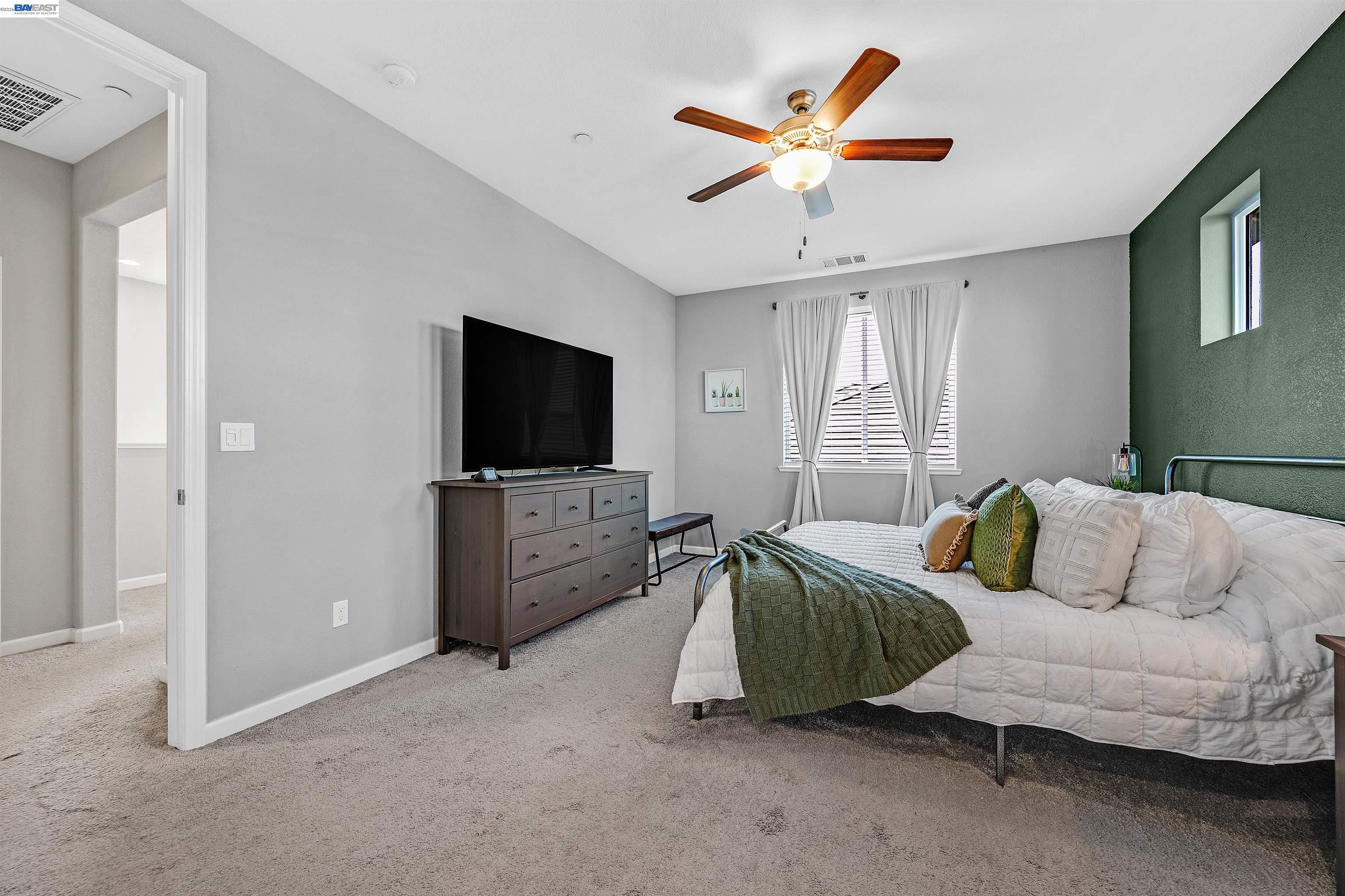 1589 Friendly Street Manteca, CA 95337 - Photo 30 of 50 a living room with furniture and a flat screen tv