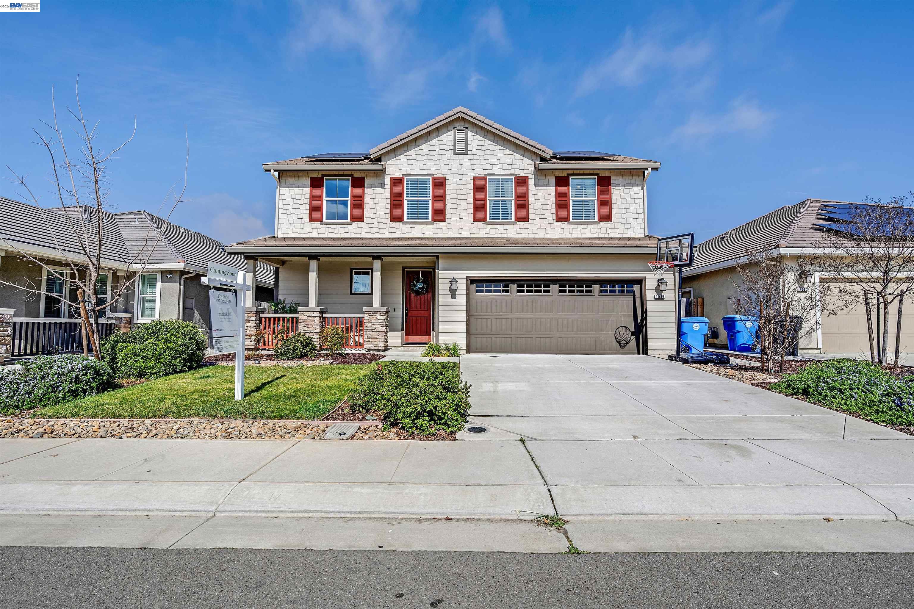 1589 Friendly Street Manteca, CA 95337 - Photo 3 of 50 front view of a house with a yard