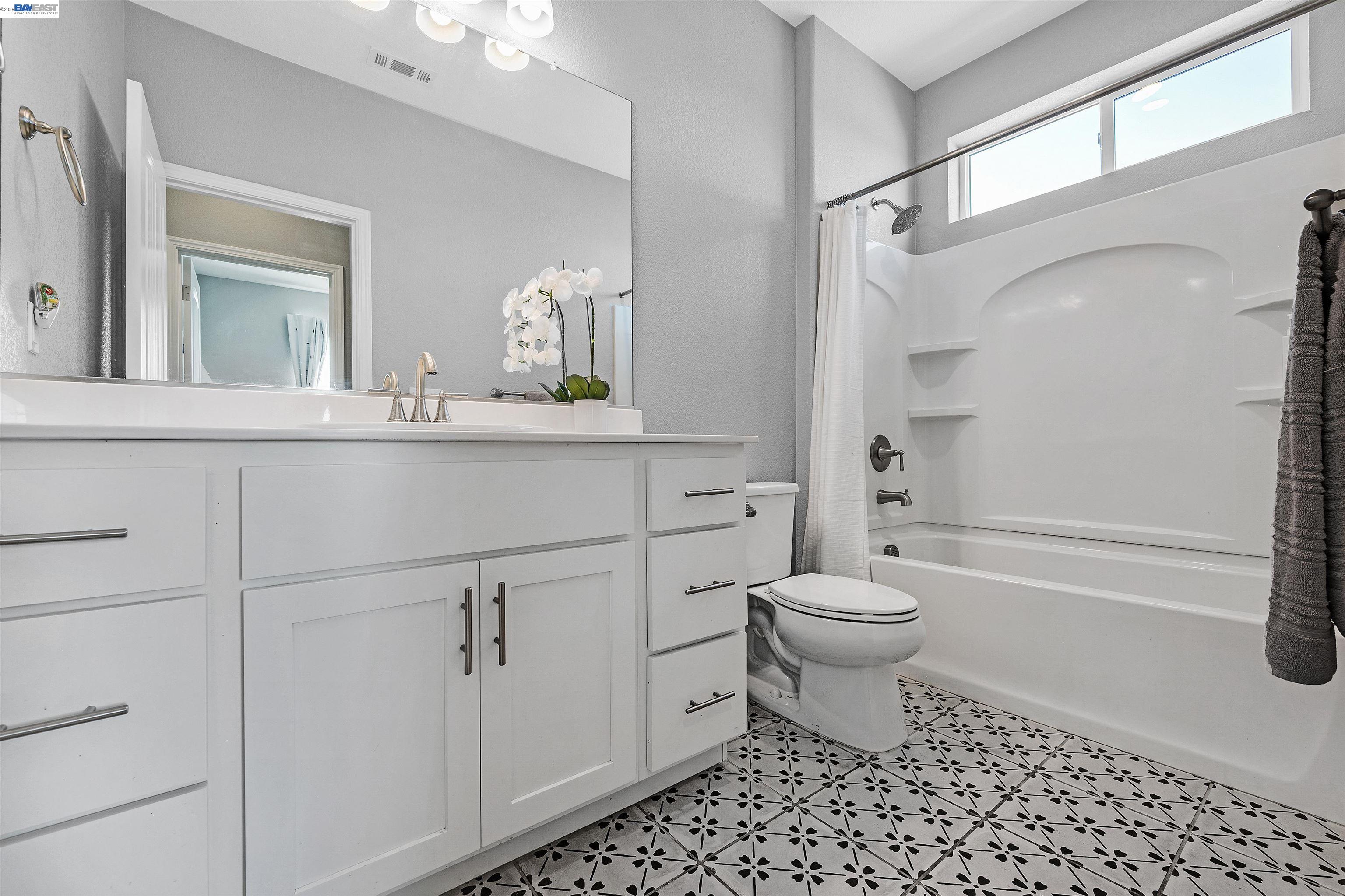 1589 Friendly Street Manteca, CA 95337 - Photo 37 of 50 a bathroom with a sink a toilet and shower