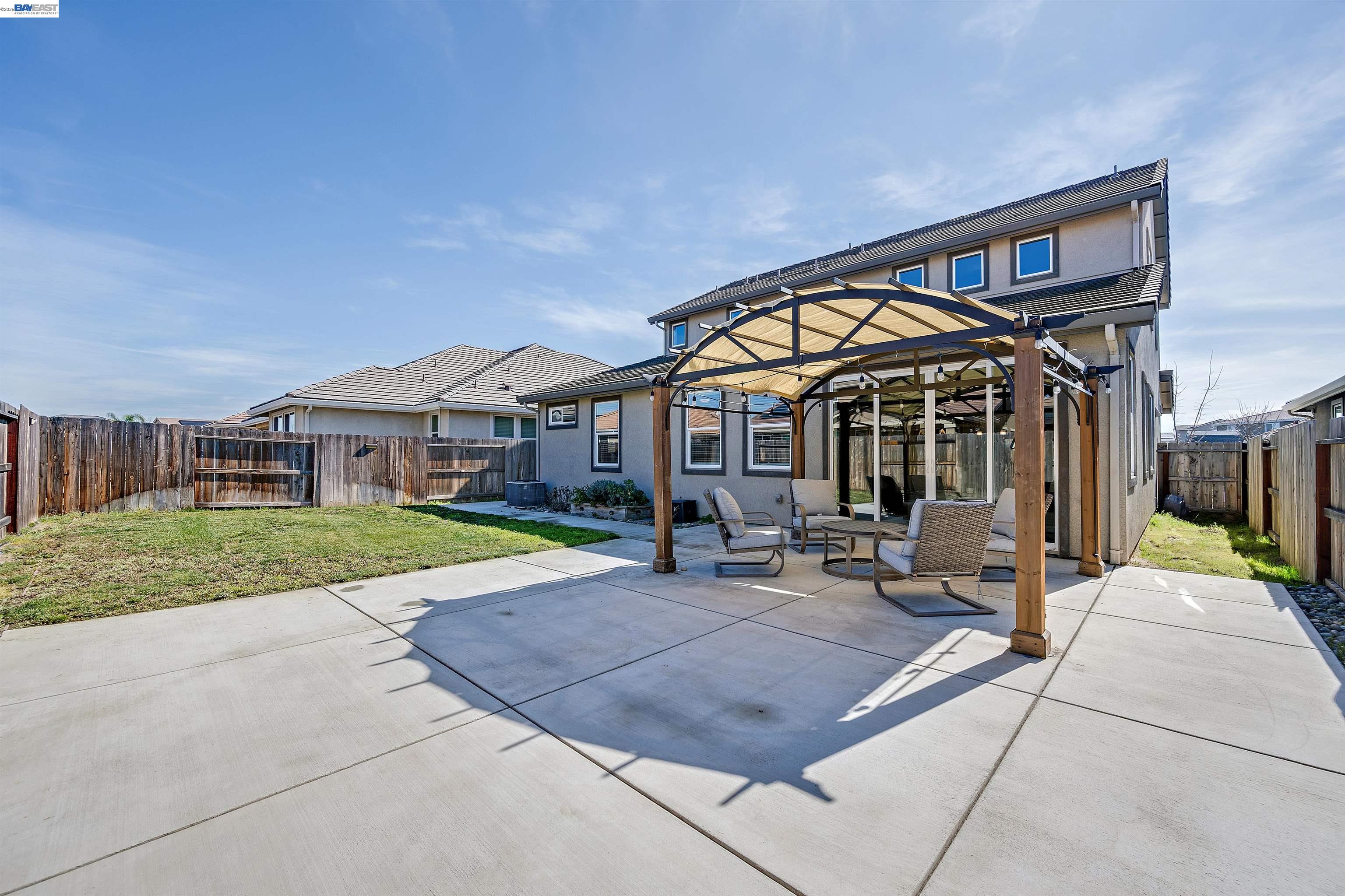1589 Friendly Street Manteca, CA 95337 - Photo 42 of 50 a view of a house with backyard porch and sitting area