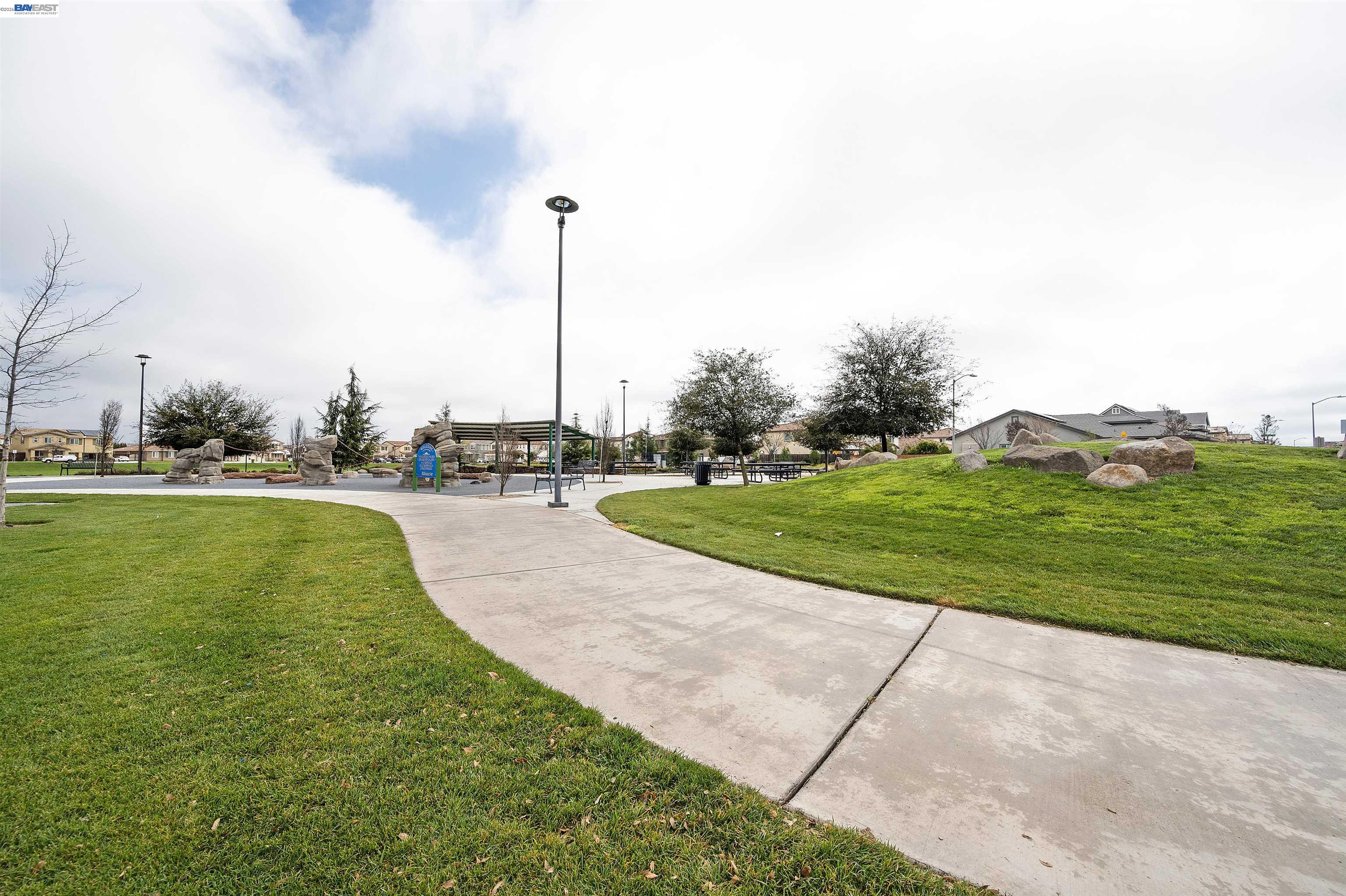 1589 Friendly Street Manteca, CA 95337 - Photo 45 of 50 a view of a garden with a fountain