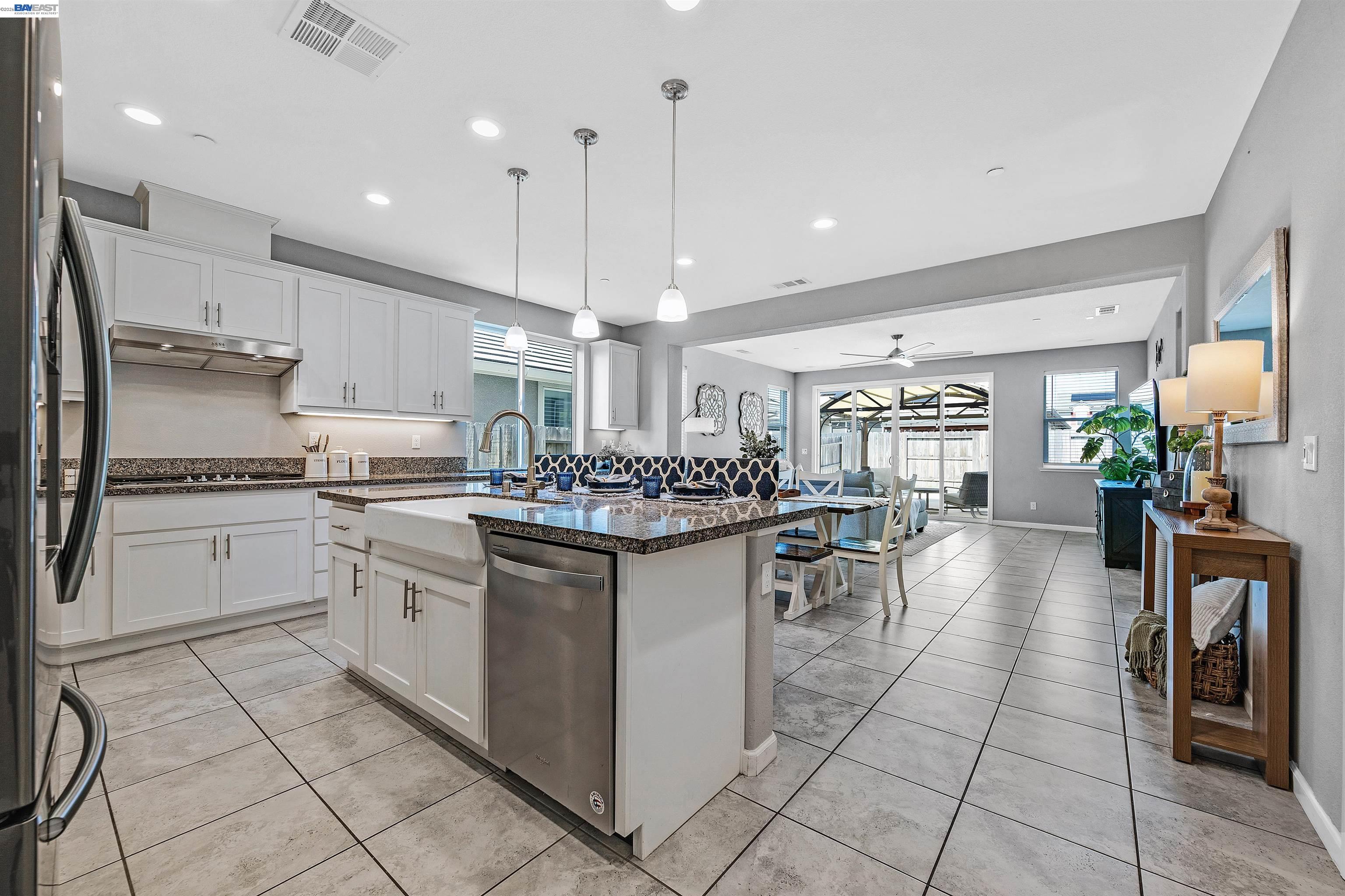 1589 Friendly Street Manteca, CA 95337 - Photo 7 of 50 a kitchen with counter top space appliances and cabinets