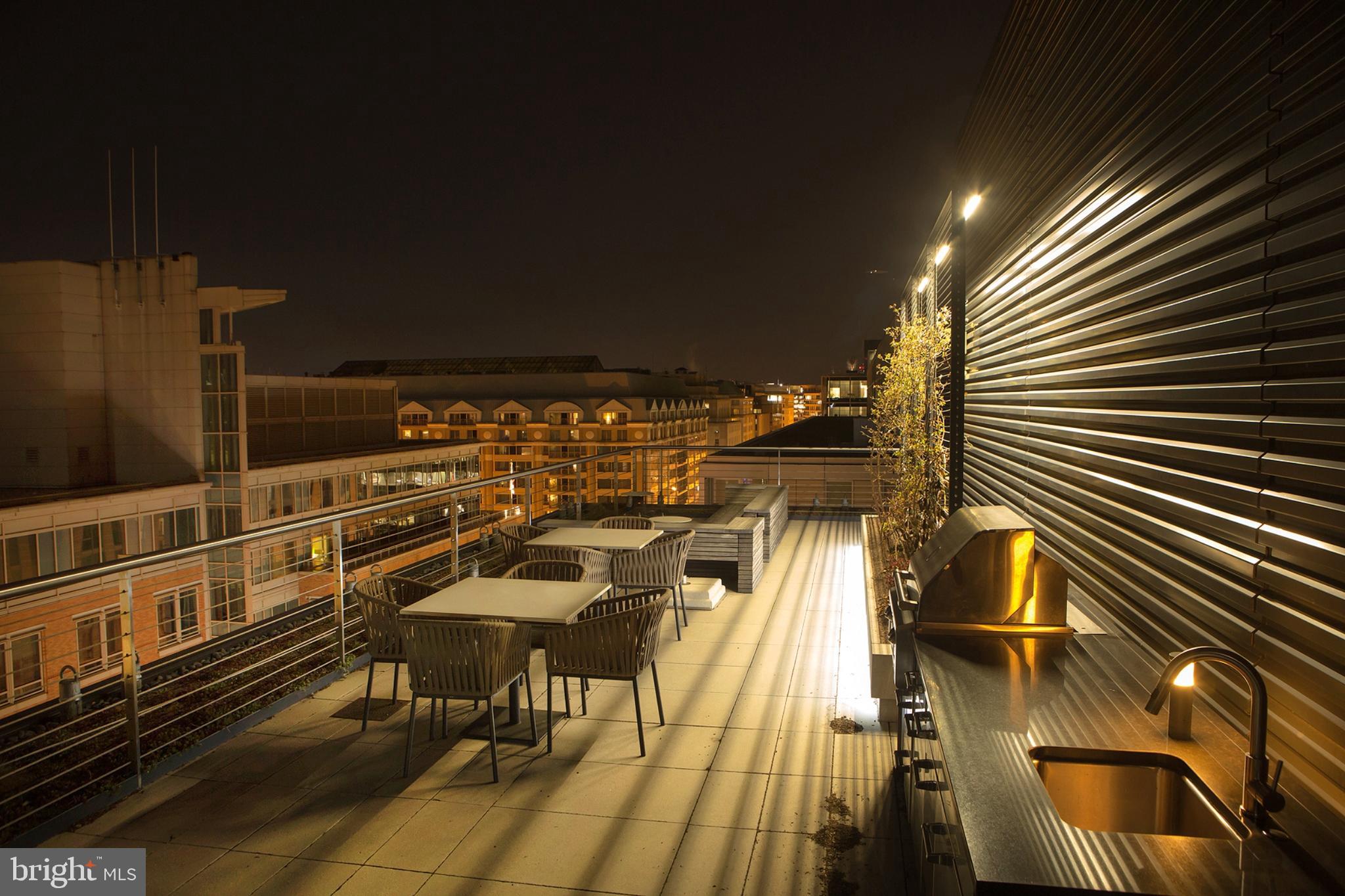 925 H Street Northwest, Unit 707 Washington, DC 20001 - Photo 30 of 43 925 H Roof Deck Cooking Area West at Night