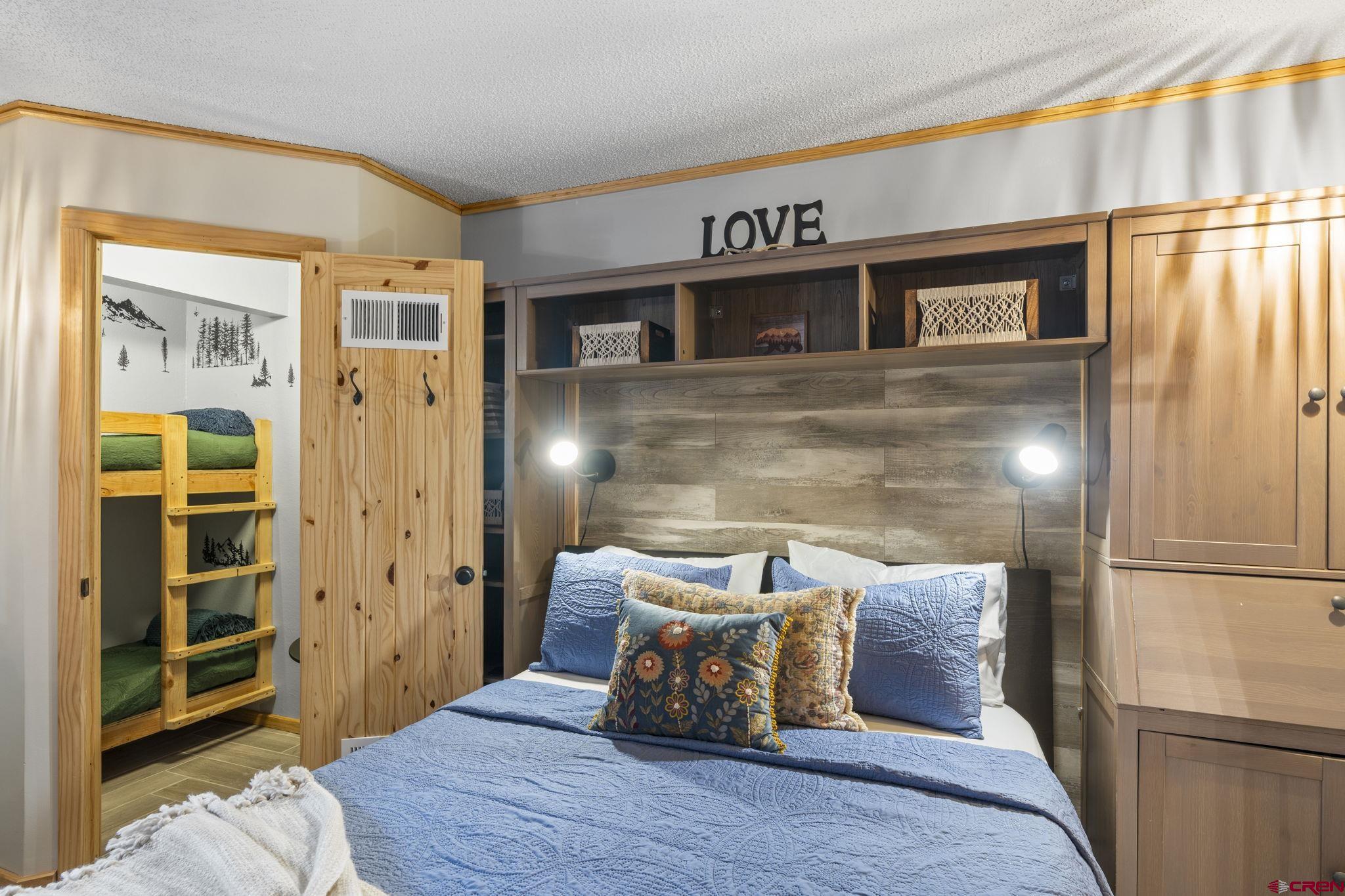 455 Sheol Street, Unit 109 Durango, CO 81301 - Photo 12 of 31 a bed room with a bed and a window