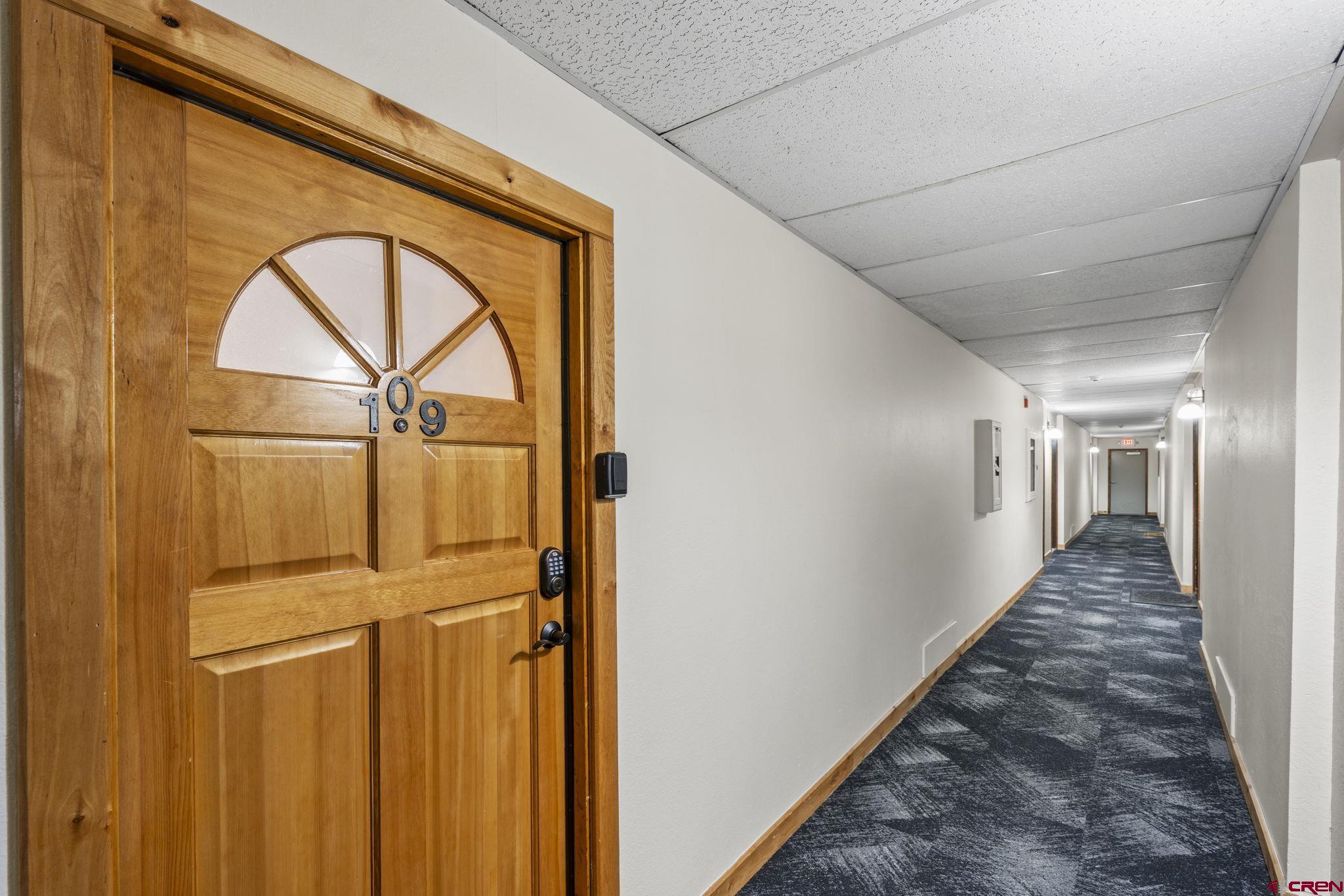 455 Sheol Street, Unit 109 Durango, CO 81301 - Photo 2 of 31 a view of a hallway with wooden floor and entryway
