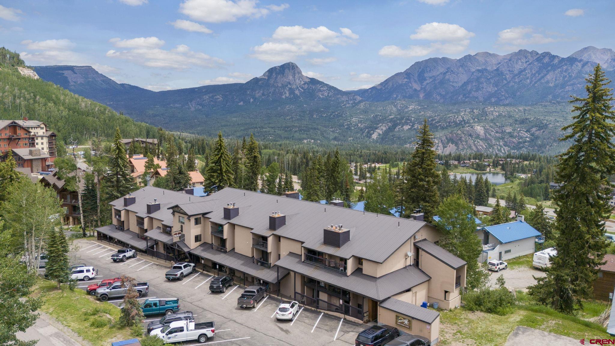 455 Sheol Street, Unit 109 Durango, CO 81301 - Photo 22 of 31 an aerial view of a house with a yard and mountain view