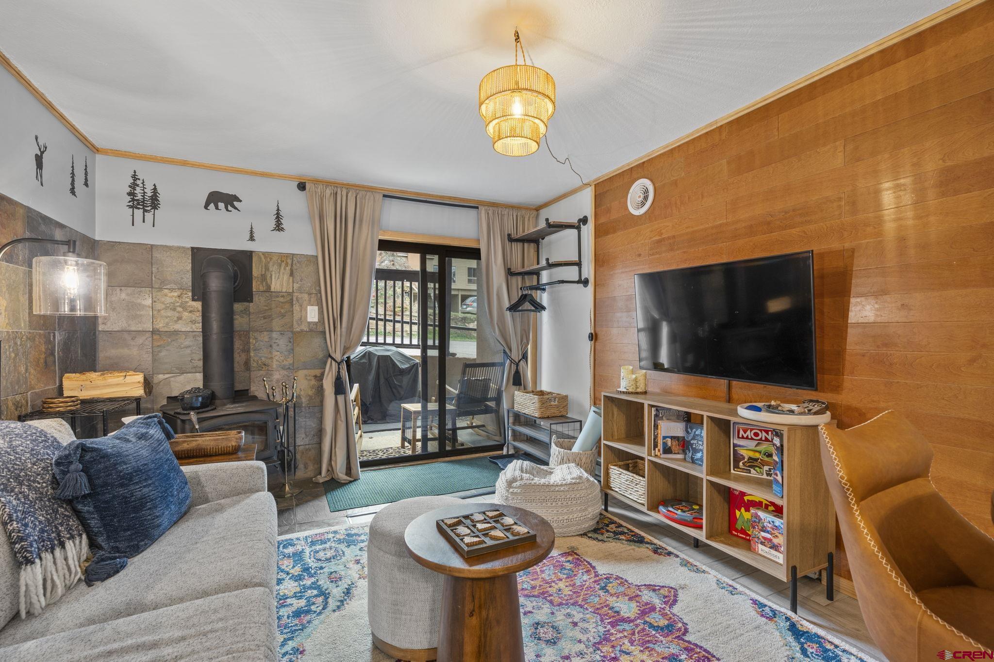 455 Sheol Street, Unit 109 Durango, CO 81301 - Photo 5 of 31 a living room with furniture and a flat screen tv