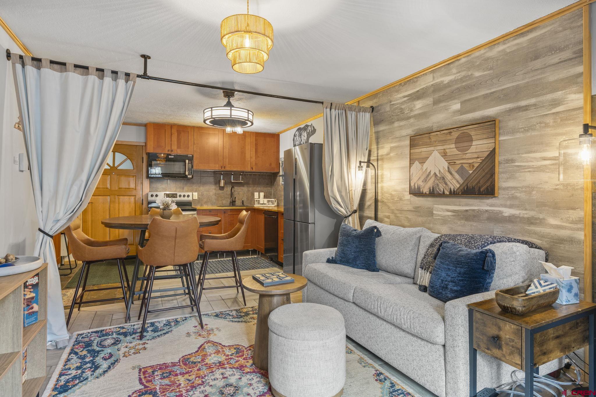 455 Sheol Street, Unit 109 Durango, CO 81301 - Photo 6 of 31 a living room with furniture and a large window