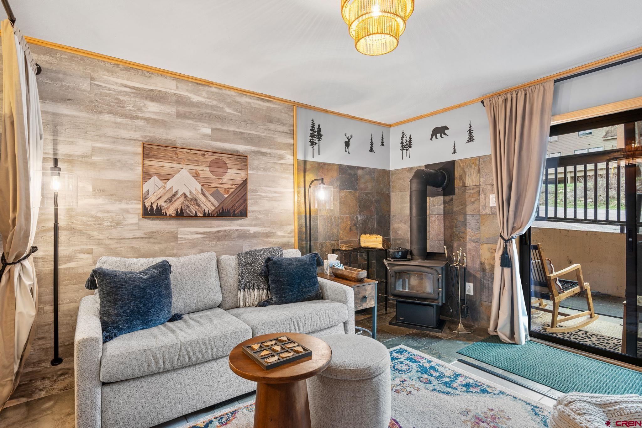 455 Sheol Street, Unit 109 Durango, CO 81301 - Photo 7 of 31 a living room with furniture and a painting on the wall