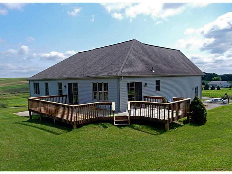 340 Church Road Fombell, PA 16123 - Photo 15 of 19 Exterior Back. SLIDING DOORS LEAD TO REAR DECKS