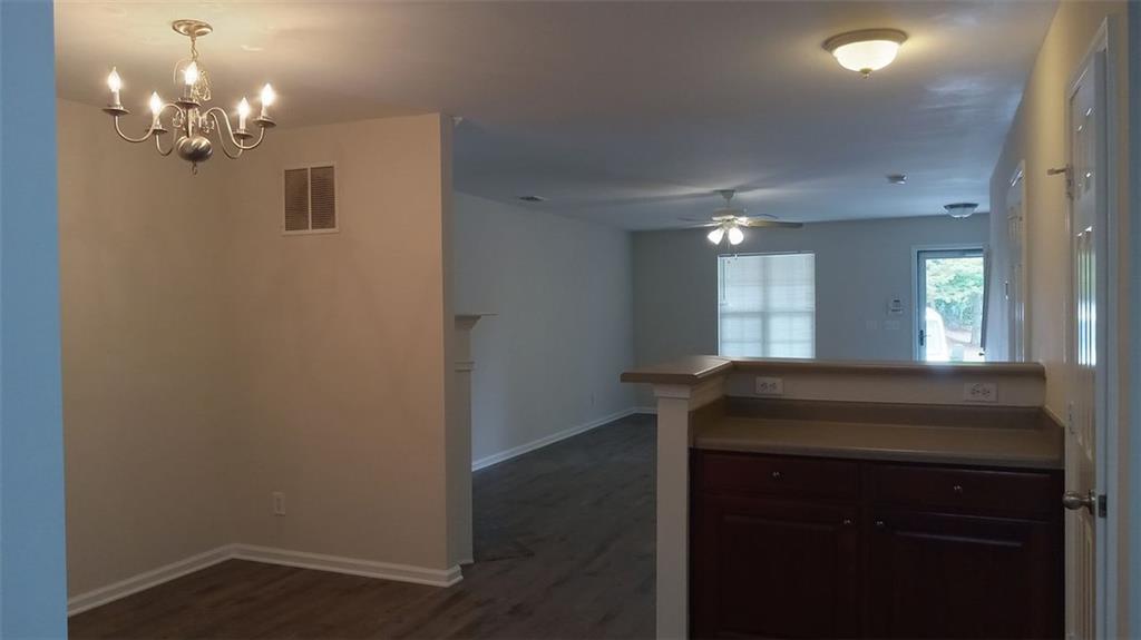 755 Crestwell Circle Atlanta, GA 30331 - Photo 11 of 29 a kitchen with a sink and chandelier