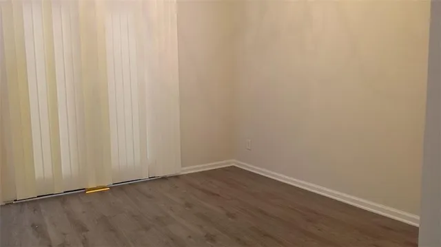 a view of a small space with wooden floor