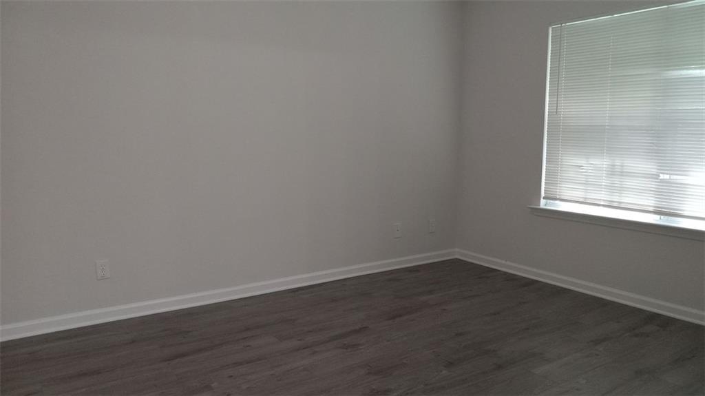 755 Crestwell Circle Atlanta, GA 30331 - Photo 29 of 29 an empty room with wooden floor and windows