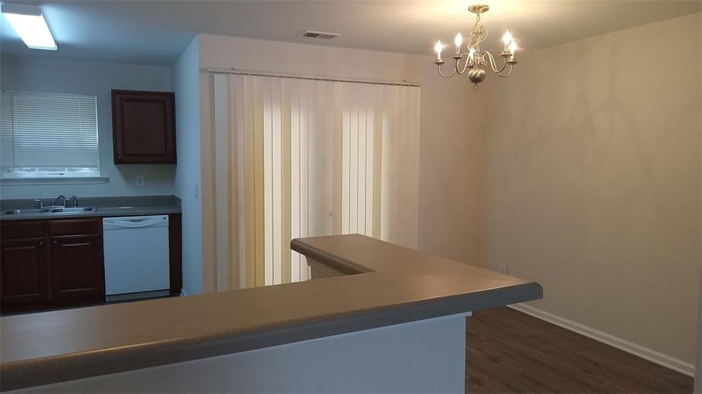 755 Crestwell Circle Atlanta, GA 30331 - Photo 6 of 29 a view of a kitchen with a sink and dishwasher