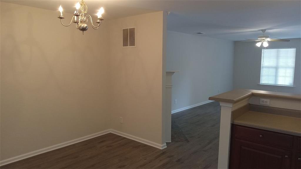 755 Crestwell Circle Atlanta, GA 30331 - Photo 10 of 29 a view of a room with wooden floor and chandelier