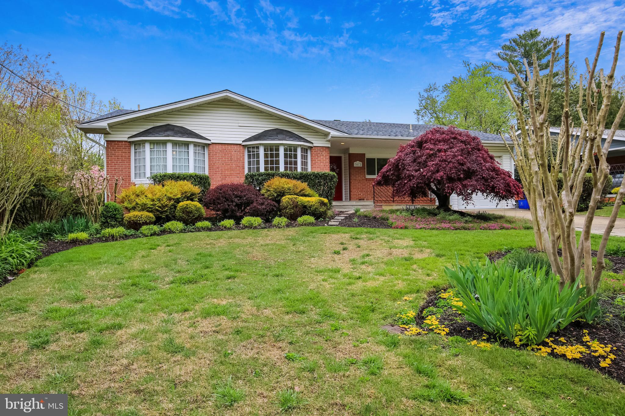 5813 Midhill Street Bethesda, MD 20817 - Photo 1 of 55 a front view of house with yard and green space