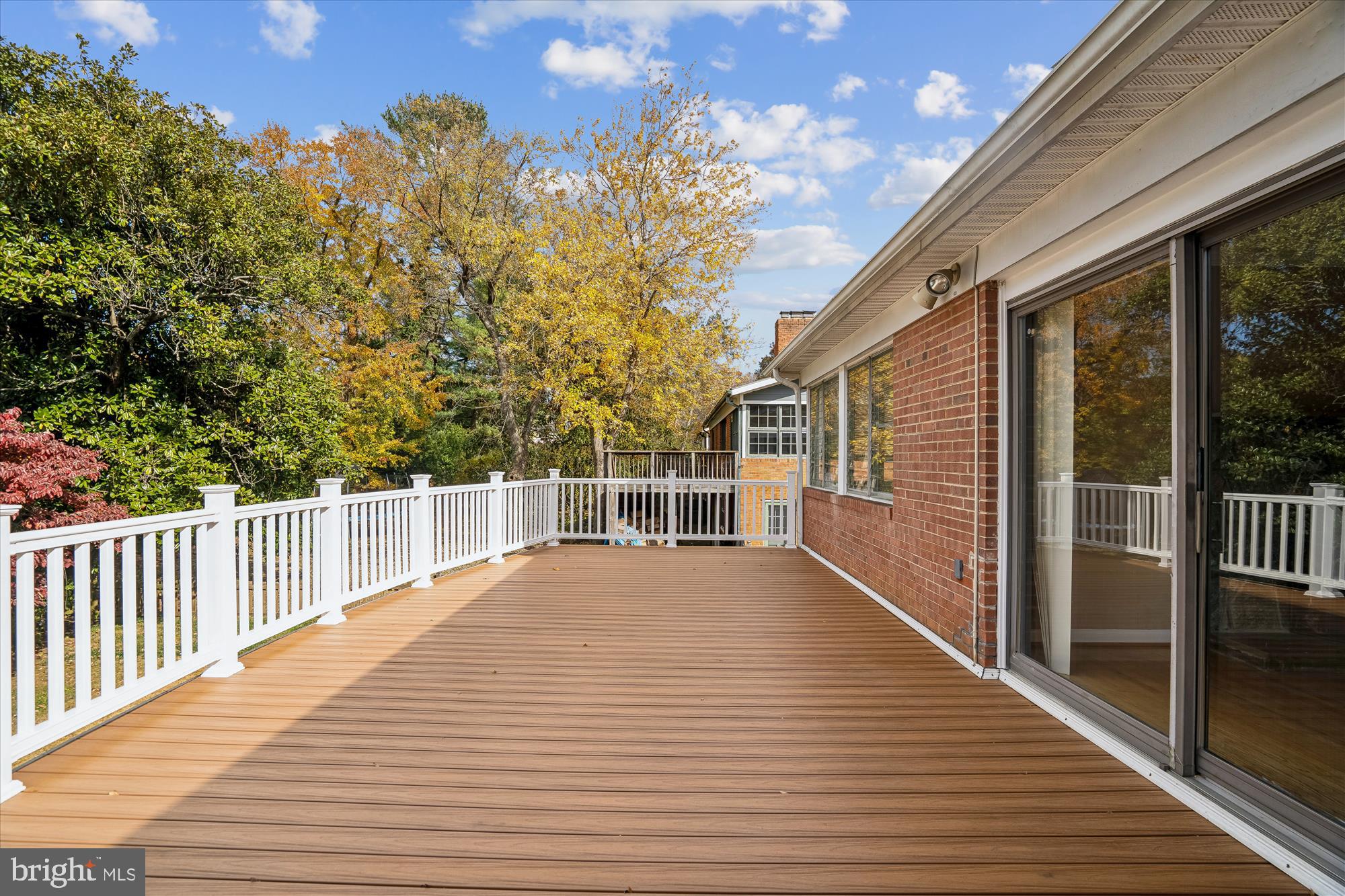 5813 Midhill Street Bethesda, MD 20817 - Photo 12 of 55 a view of a balcony with wooden floor and fence
