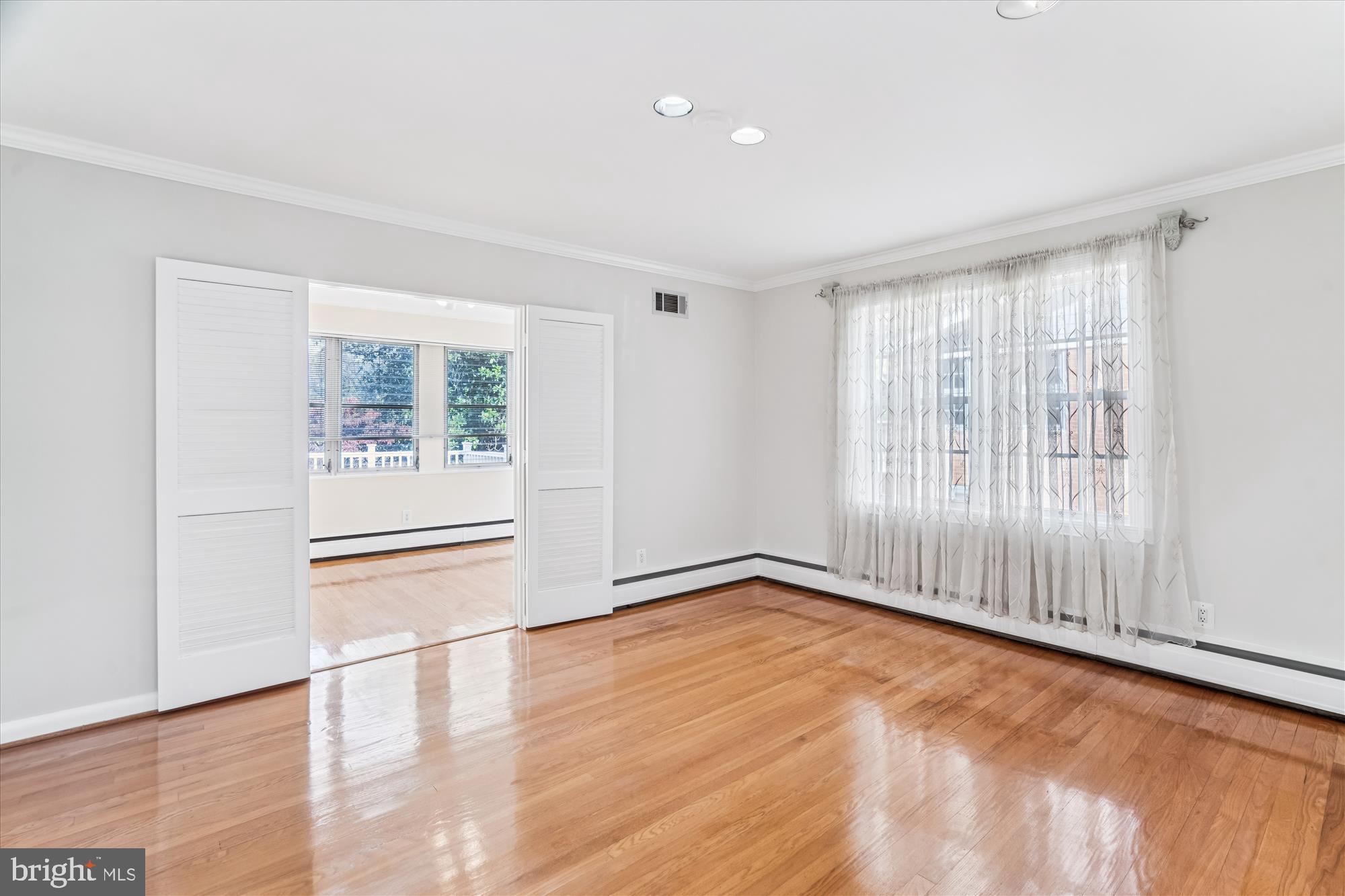 5813 Midhill Street Bethesda, MD 20817 - Photo 14 of 55 wooden floor in an empty room with a window