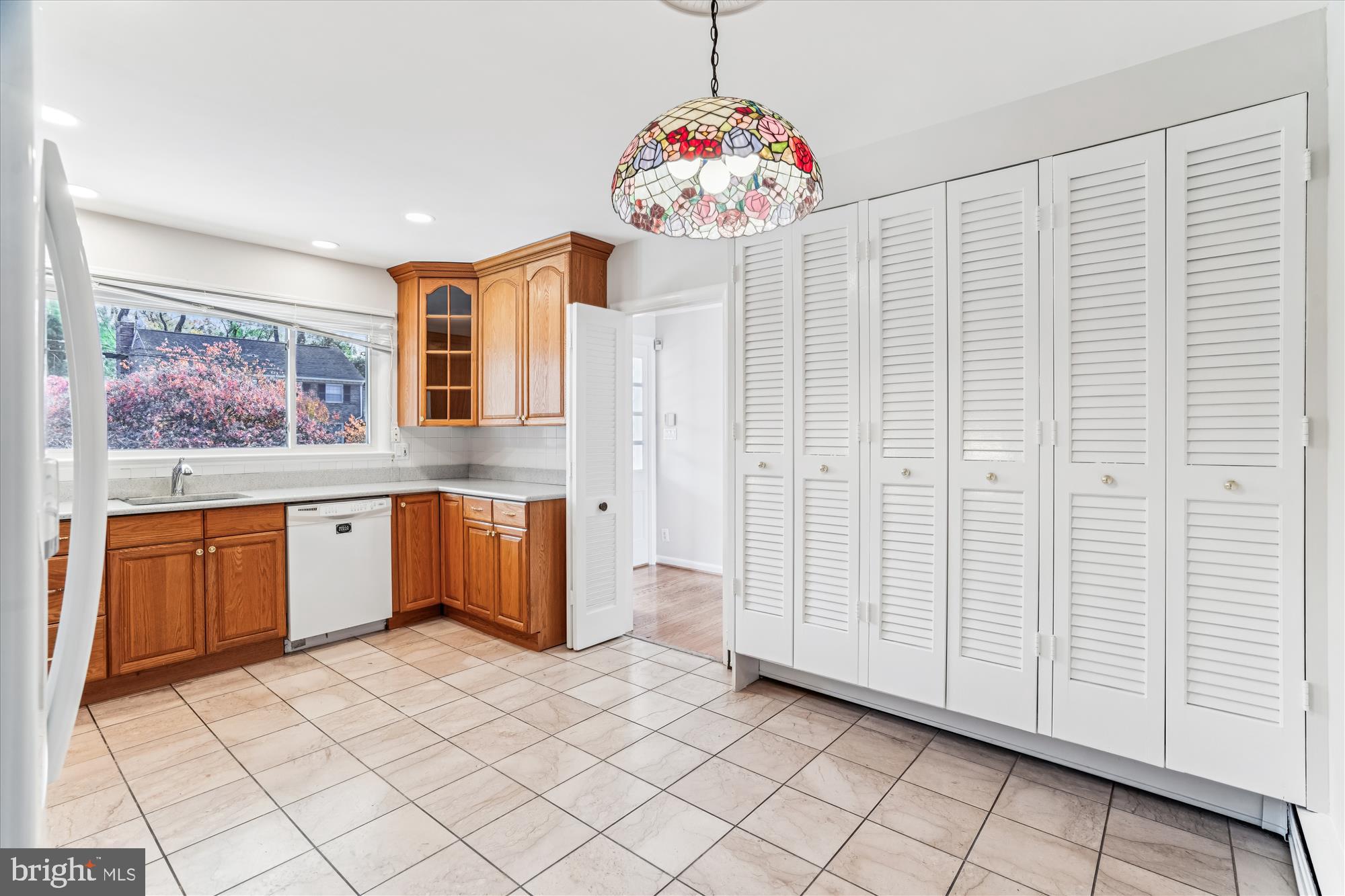 5813 Midhill Street Bethesda, MD 20817 - Photo 19 of 55 a kitchen with stainless steel appliances granite countertop a sink and cabinets