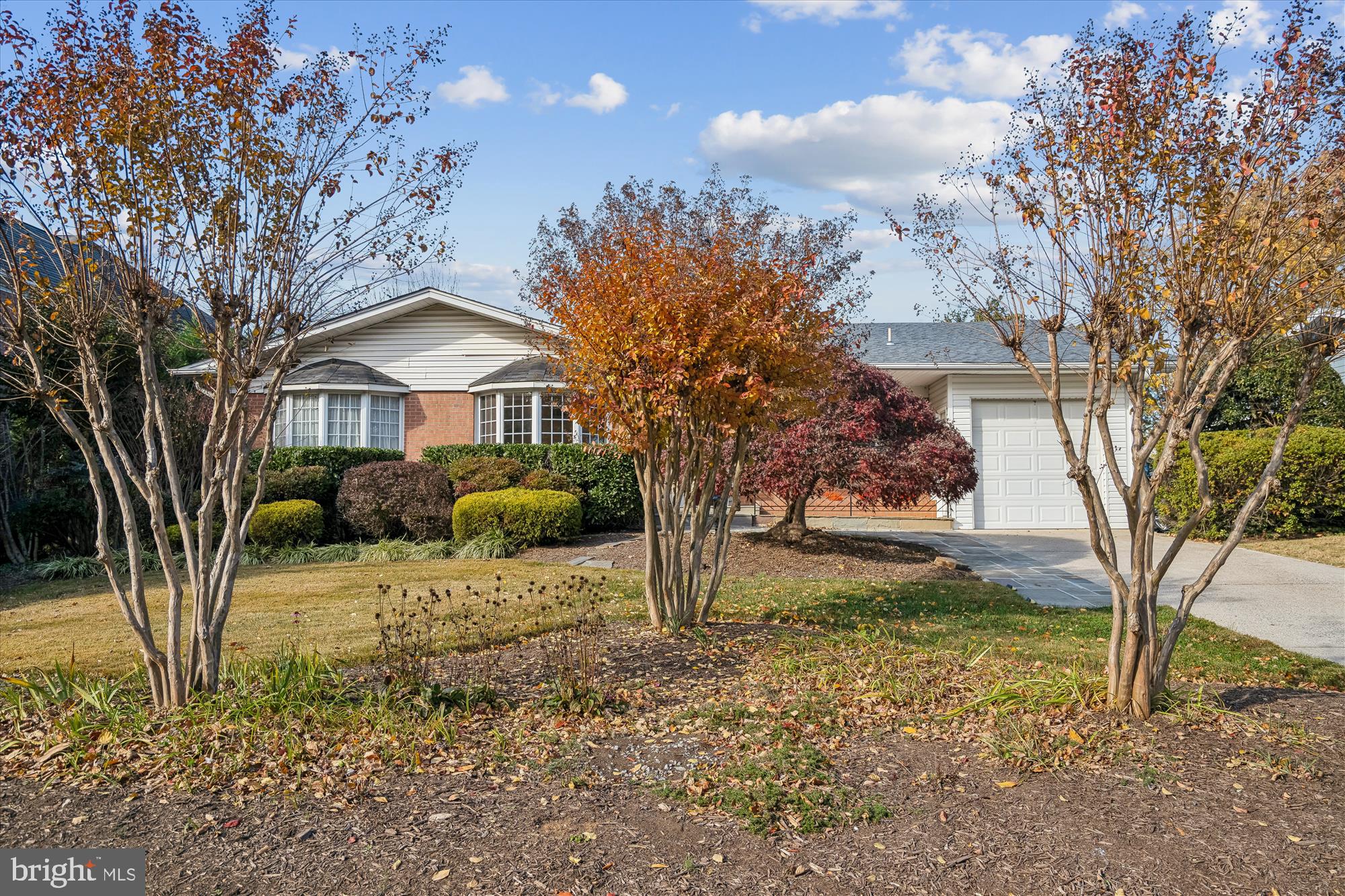 5813 Midhill Street Bethesda, MD 20817 - Photo 2 of 55 a front view of a house with garden