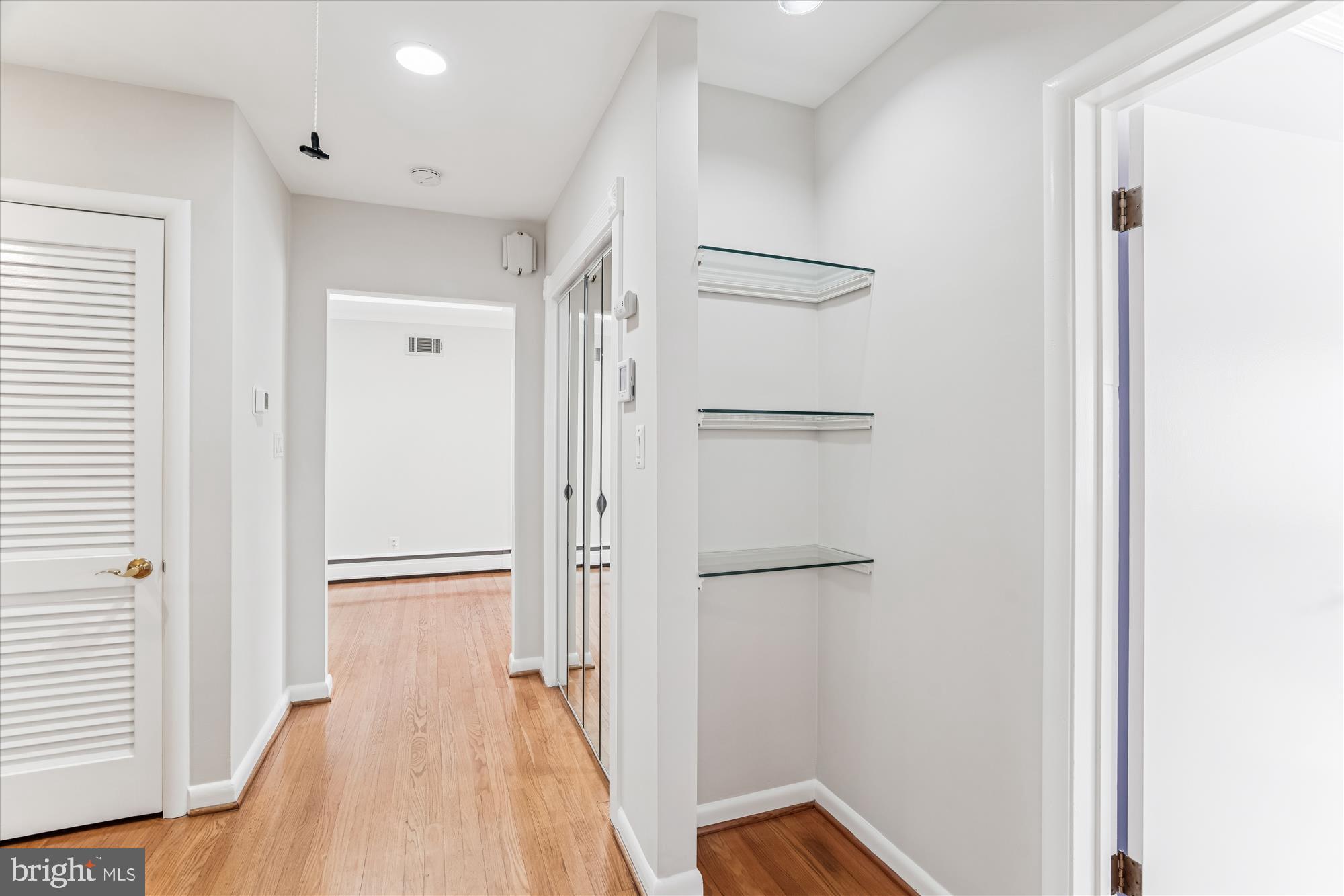 5813 Midhill Street Bethesda, MD 20817 - Photo 22 of 55 a view of a room with wooden floor and a bathroom