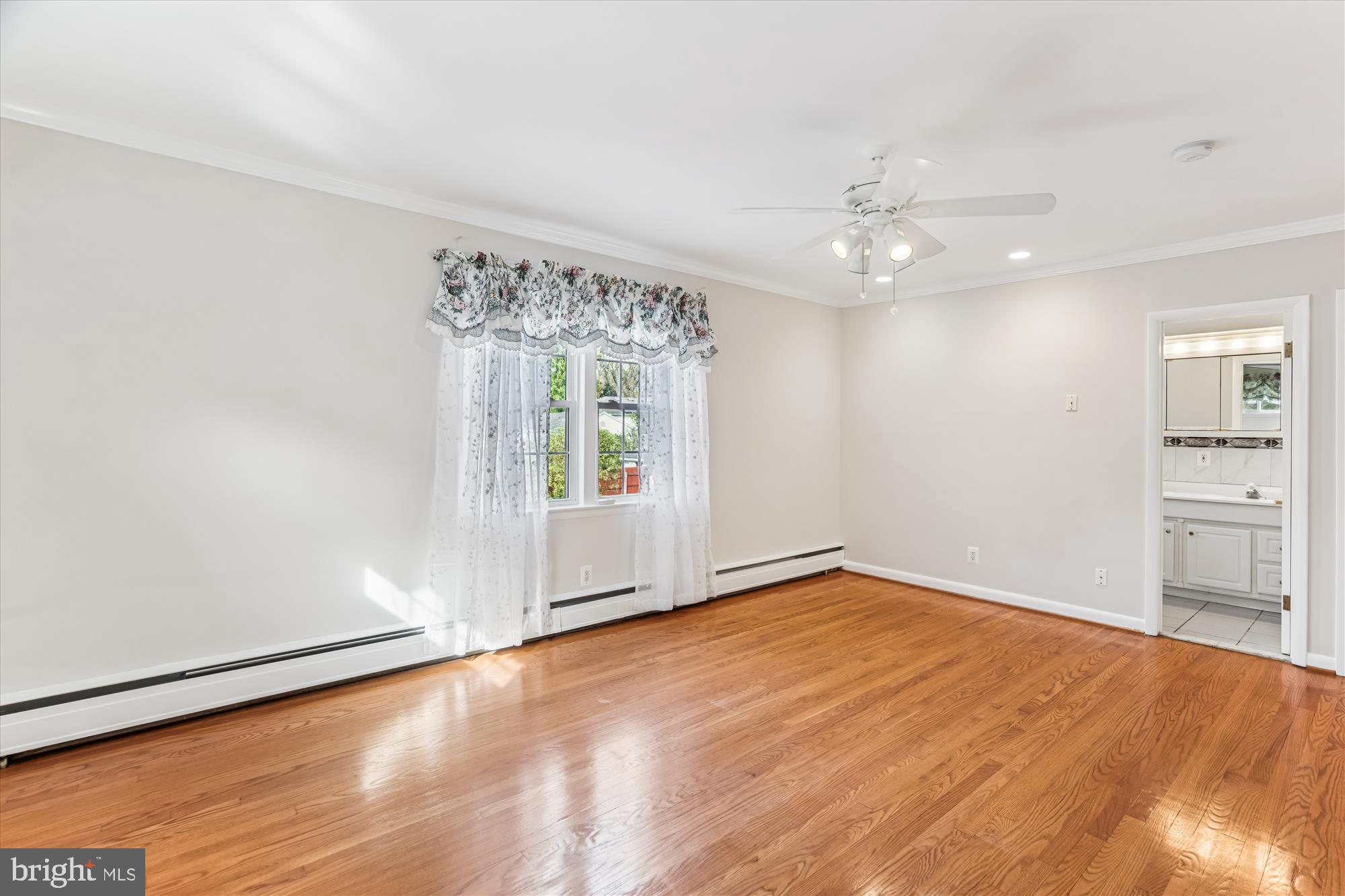 5813 Midhill Street Bethesda, MD 20817 - Photo 24 of 55 wooden floor in an empty room with a window