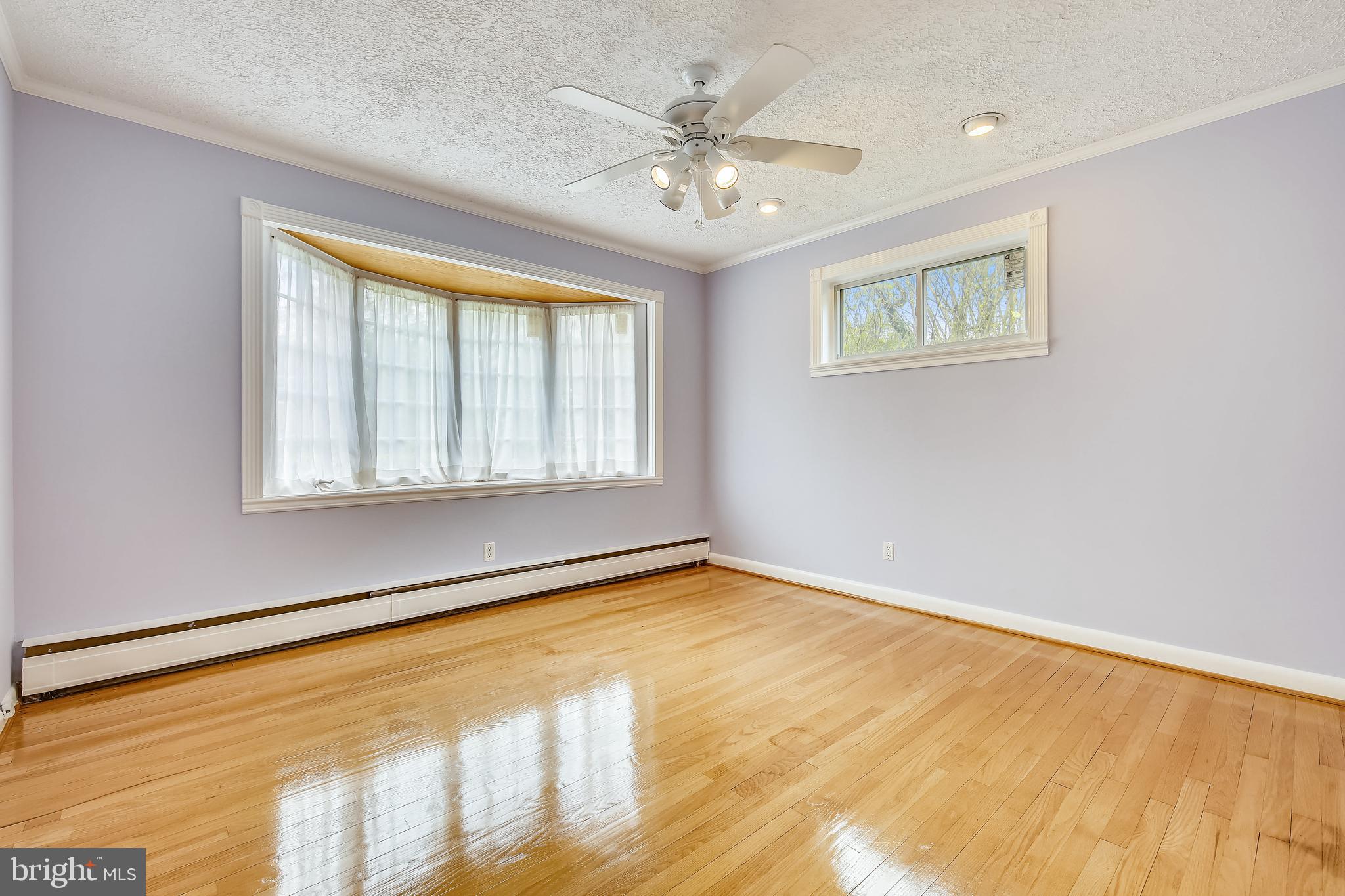 5813 Midhill Street Bethesda, MD 20817 - Photo 28 of 55 a view of an empty room with a window
