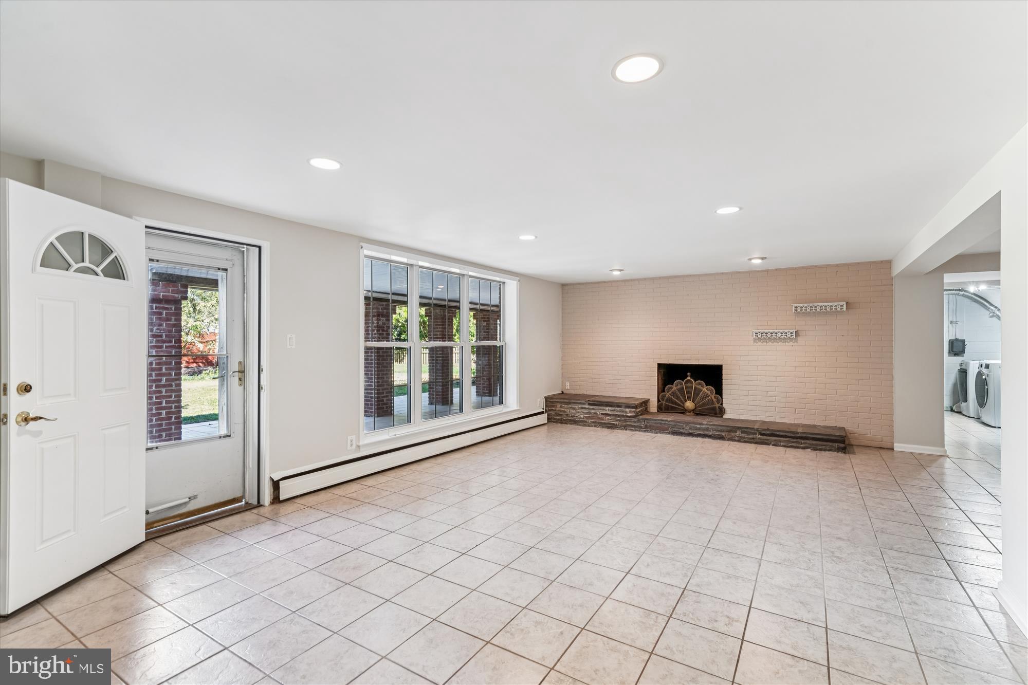 5813 Midhill Street Bethesda, MD 20817 - Photo 30 of 55 an empty room with windows and pillars in it