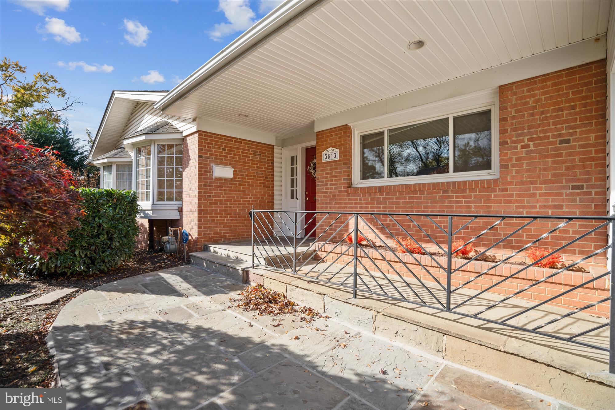 5813 Midhill Street Bethesda, MD 20817 - Photo 3 of 55 a patio with table and chairs and potted plants