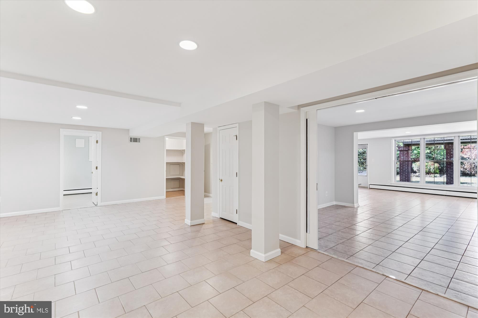 5813 Midhill Street Bethesda, MD 20817 - Photo 39 of 55 a view of an empty room with window and wooden floor