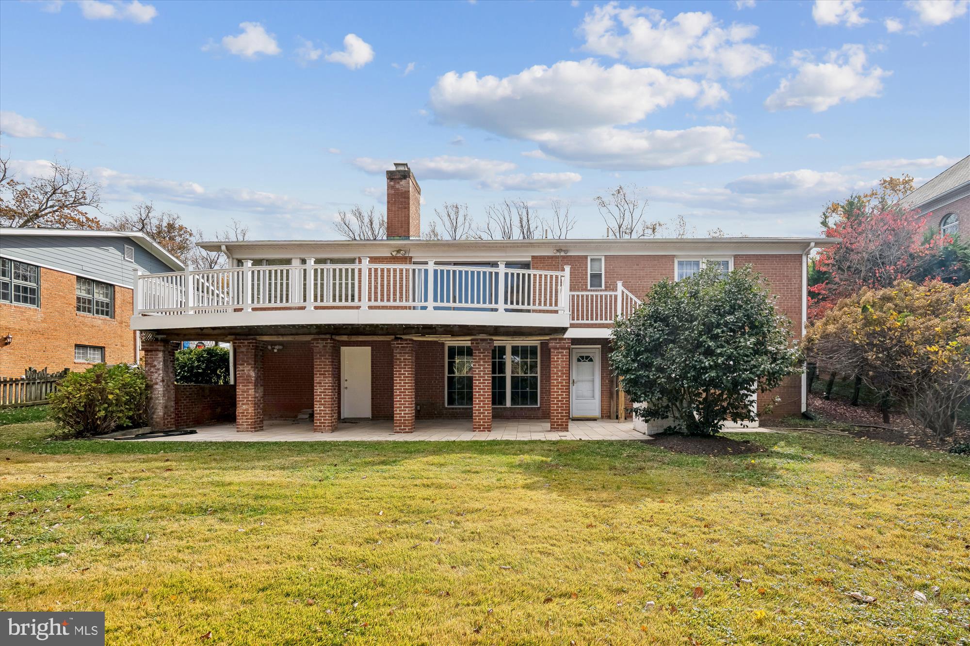 5813 Midhill Street Bethesda, MD 20817 - Photo 42 of 55 a front view of a house with a yard