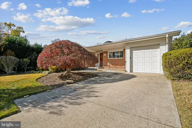 a swimming pool with outdoor seating and yard