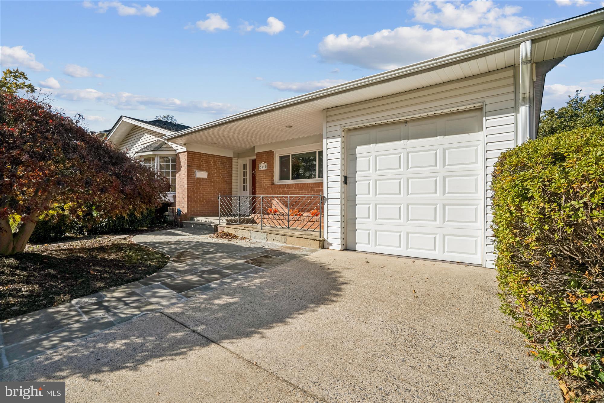 5813 Midhill Street Bethesda, MD 20817 - Photo 49 of 55 a view of a house with a yard and garage