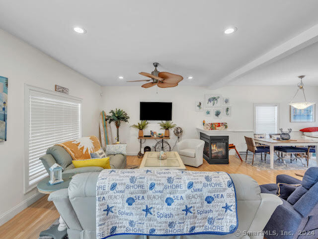 17 Spring Glen Road, Unit A East Lyme, CT 06357 - Photo 11 of 32 a bedroom with furniture and a flat screen tv