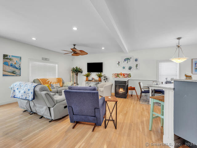 17 Spring Glen Road, Unit A East Lyme, CT 06357 - Photo 13 of 32 a living room with furniture and a flat screen tv