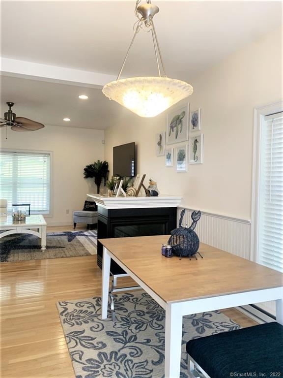 17 Spring Glen Road, Unit A East Lyme, CT 06357 - Photo 14 of 32 a living room with a table and chairs