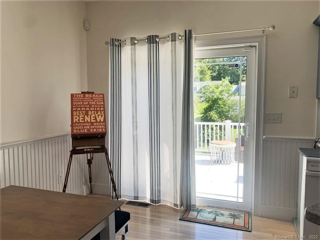 17 Spring Glen Road, Unit A East Lyme, CT 06357 - Photo 15 of 32 a view of a room with wooden floor and windows