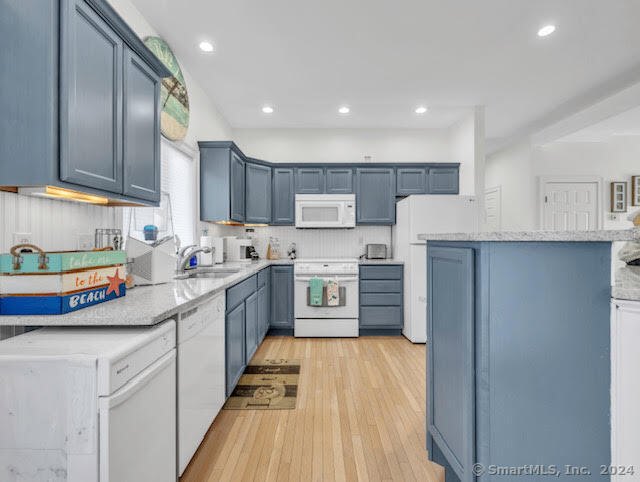 17 Spring Glen Road, Unit A East Lyme, CT 06357 - Photo 18 of 32 a kitchen with stainless steel appliances granite countertop a sink and cabinets
