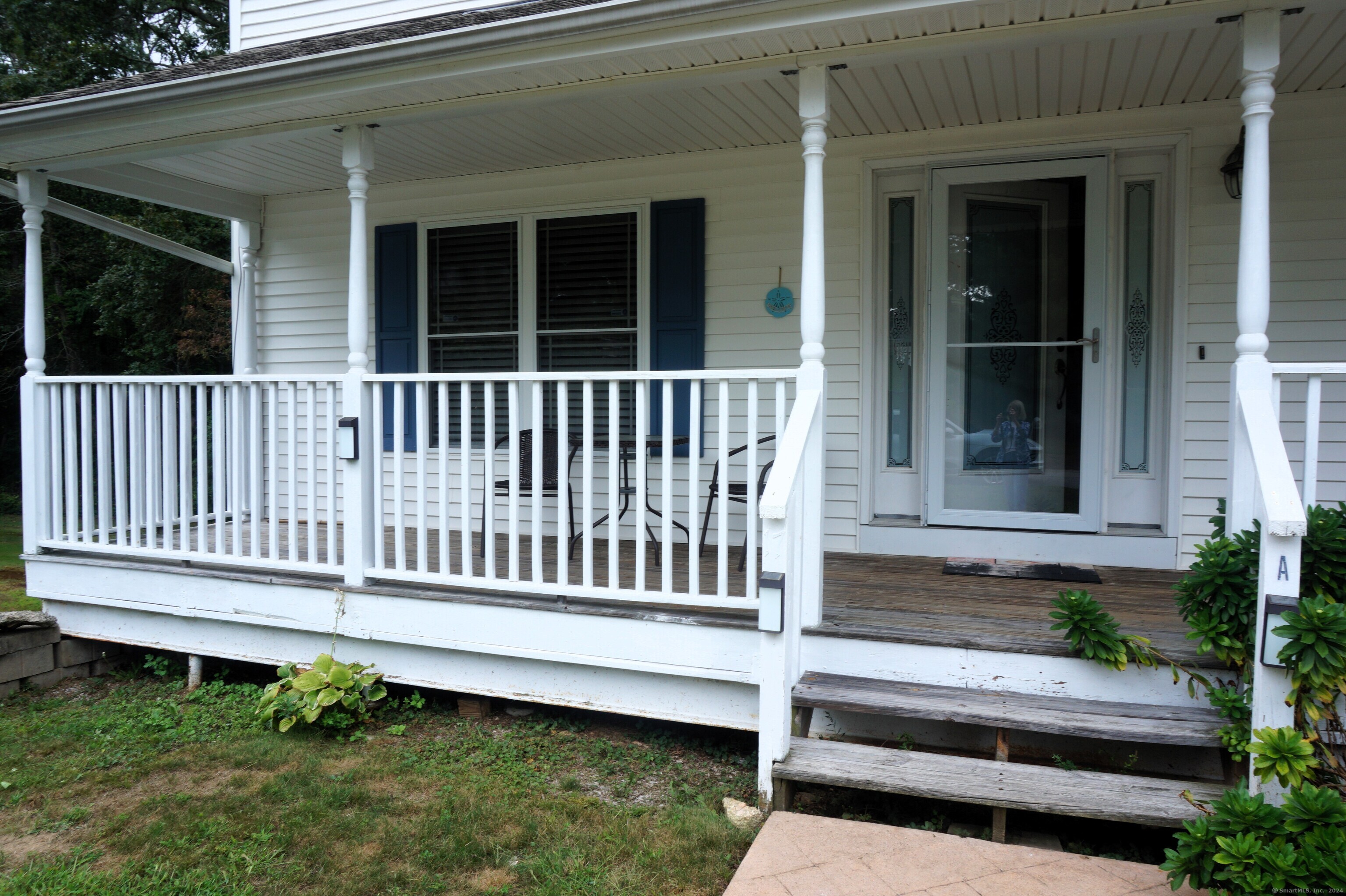 17 Spring Glen Road, Unit A East Lyme, CT 06357 - Photo 2 of 32 a view of a house with wooden deck and a chair